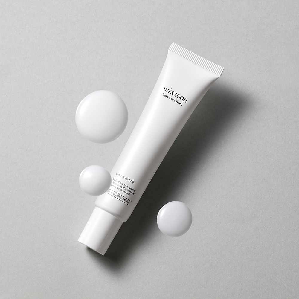 mixsoon Bean Eye Cream on a gray background with graphical white dollops
