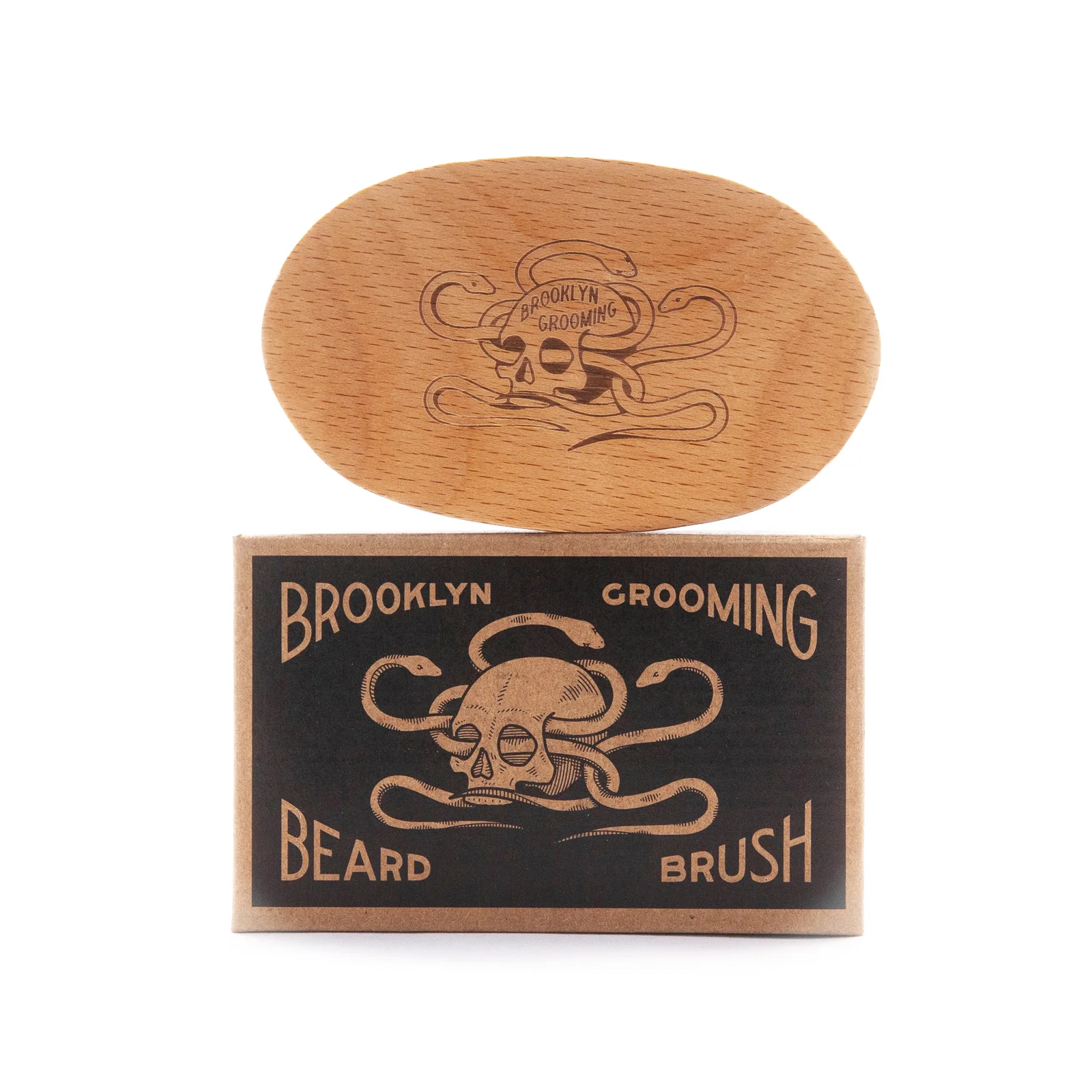 Wooden beard brush with Brooklyn Grooming logo on a white background