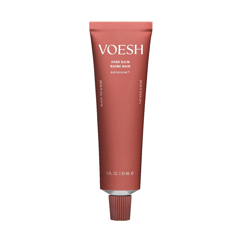A single tube of VOESH Hand Balm, featuring a dusty rose-colored squeeze tube with white text and a matching ribbed cap, centered on a plain white background.