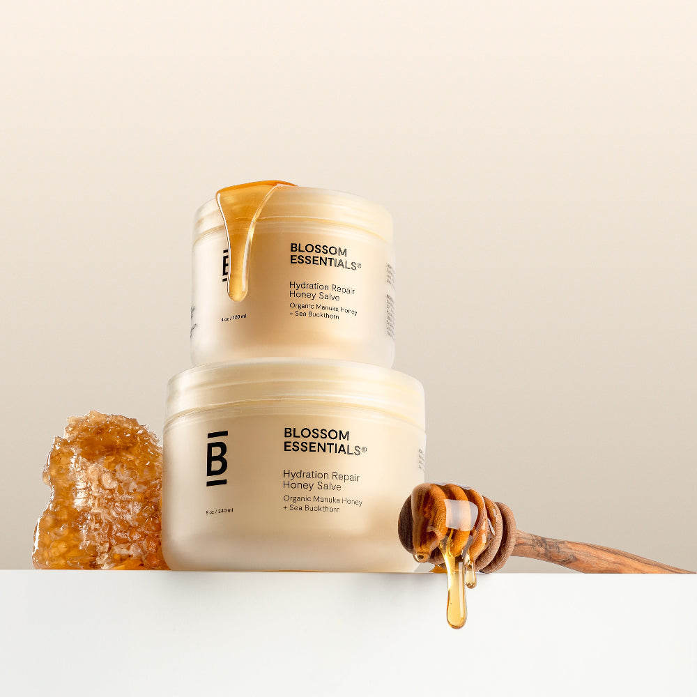 Blossom Essentials jar with honeycomb and honey drizzle on a neutral background