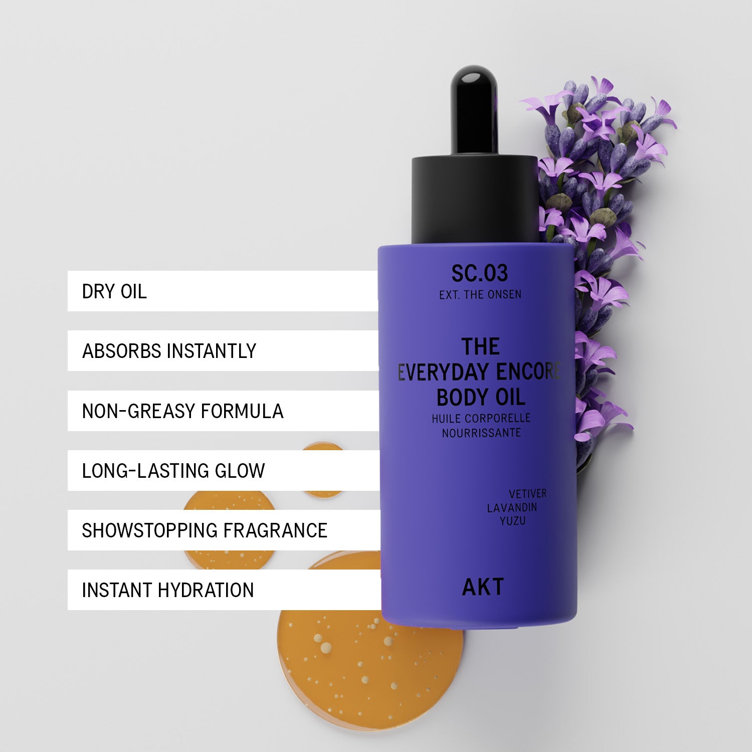 A purple bottle of AKT The Everyday Encore Body Oil Sc.03 with a black dropper cap, styled with purple lavender flowers and a gold-colored body oil droplet on a light gray background with feature text overlays.