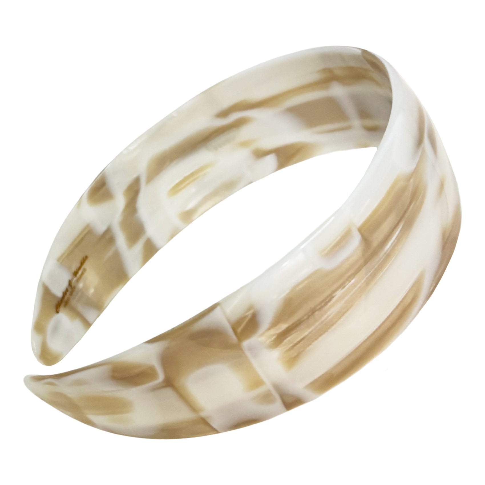 Marbled beige and tan headband on a white background
