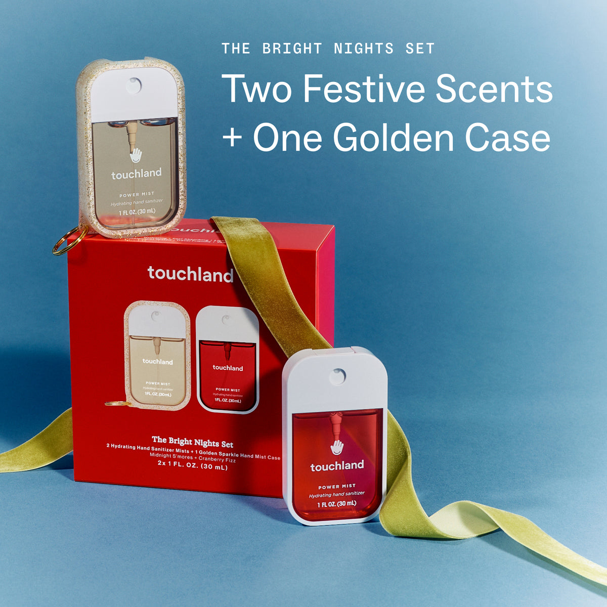 Touchland 'The Bright Nights Set' featuring two red and gold perfume bottles alongside their red packaging box and a decorative gold ribbon, set against a blue background with promotional text.