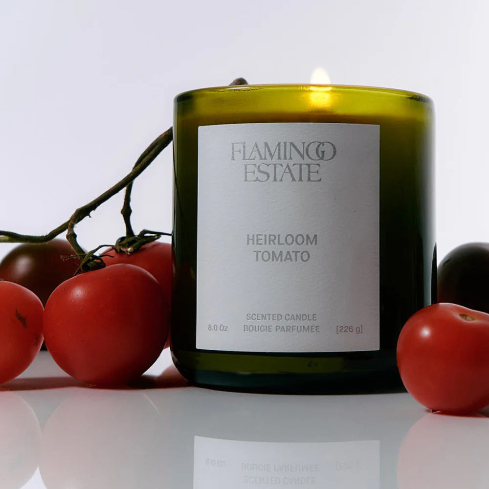 Flamingo Estate Heirloom Tomato candle with tomatoes on a white background