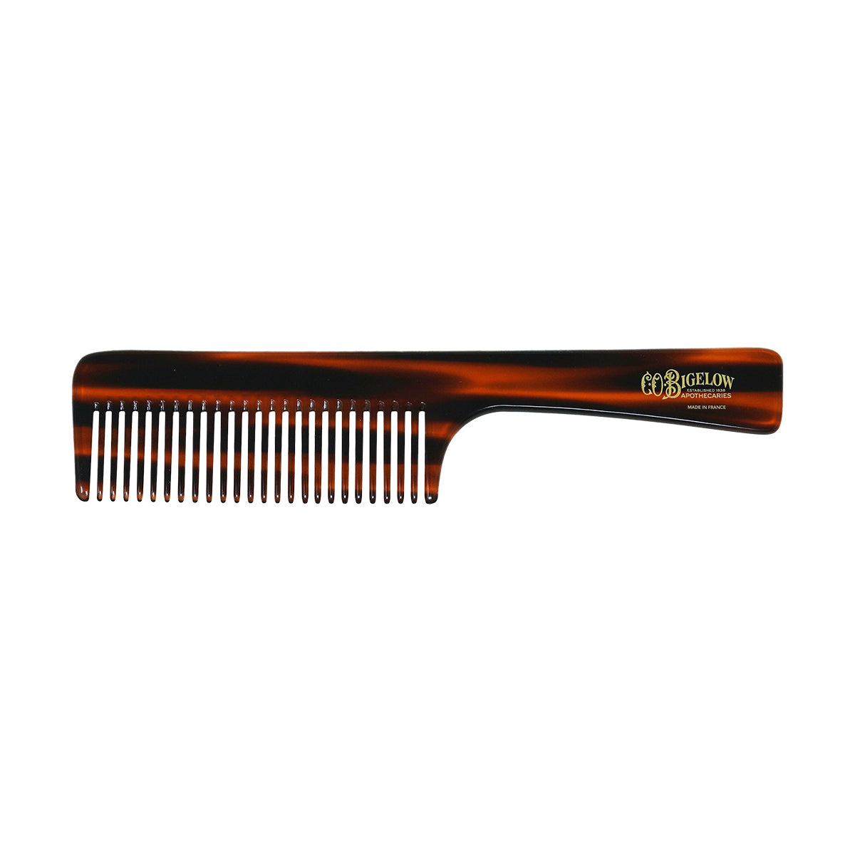Tortoiseshell comb with 'C.O.Bigelow' branding on a white background