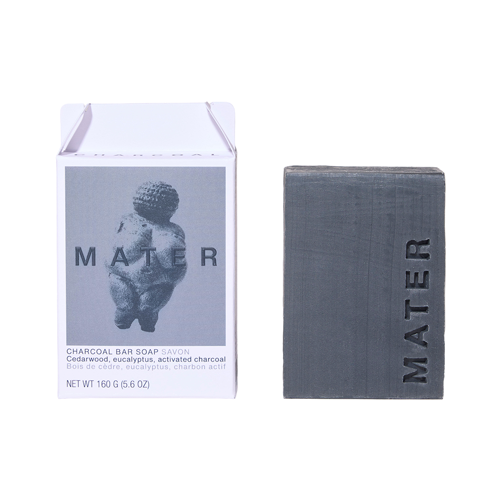 MATER Charcoal Bar Soap shown with its white paper packaging box on a clean white background. The box features a gray graphic of the Bather motif and text identifying the ingredients and 160g weight.