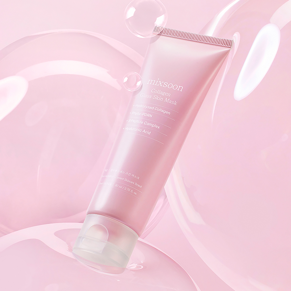 A pink cosmetic tube labeled 'mixsoon Collagen Glass Skin Mask' floating on a soft pink abstract background with translucent bubble-like shapes.