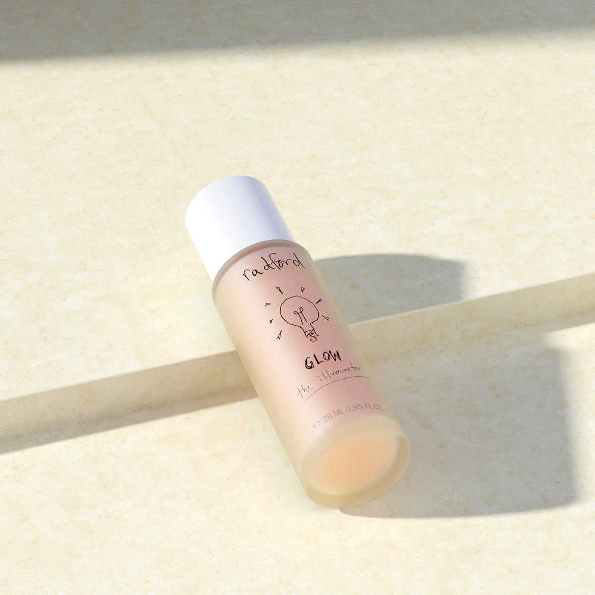 Bottle of Radford Glow the Illuminator on a light background with strong lighting