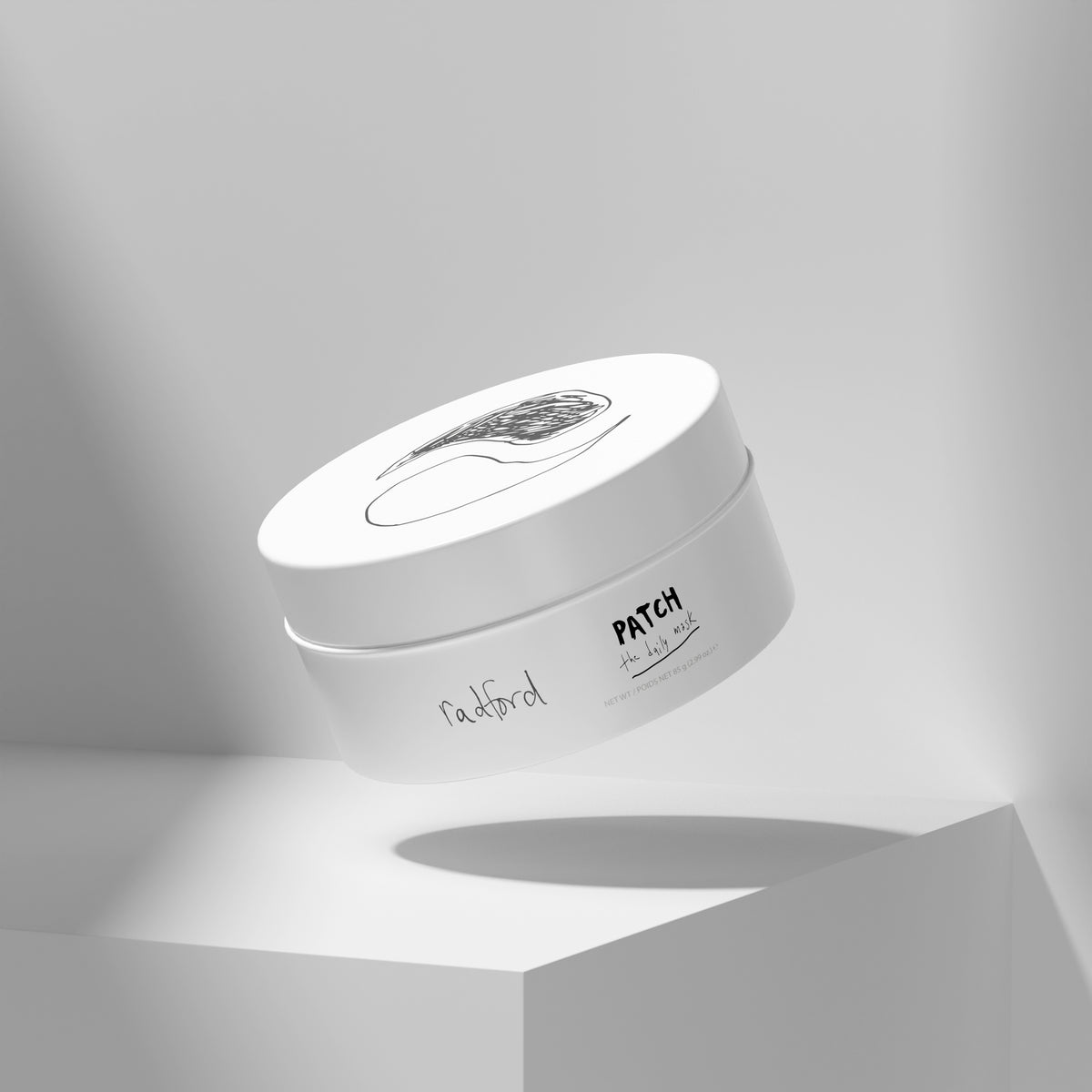 Packaging of Radford Patch - the daily mask floating above a white pedestal in a clean studio setting with soft shadows.