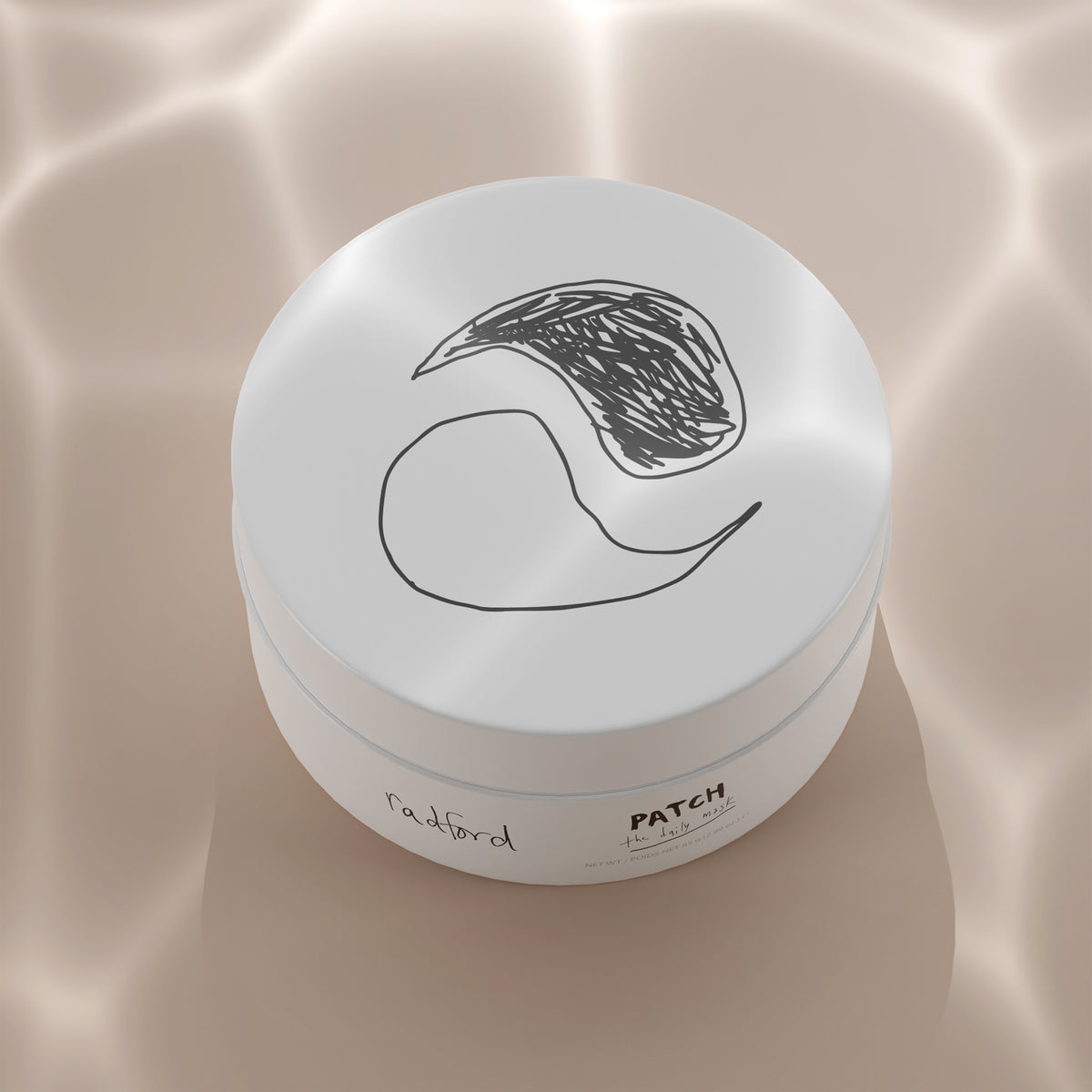 Jar of Radford Patch - the daily mask photographed from a high angle on a beige surface with soft reflective lights and shadow