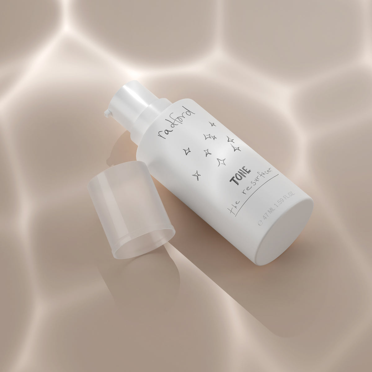 A white pump bottle of Radford Tone: the resurfacer with its translucent cap removed, set on a warm beige background with soft light reflections.