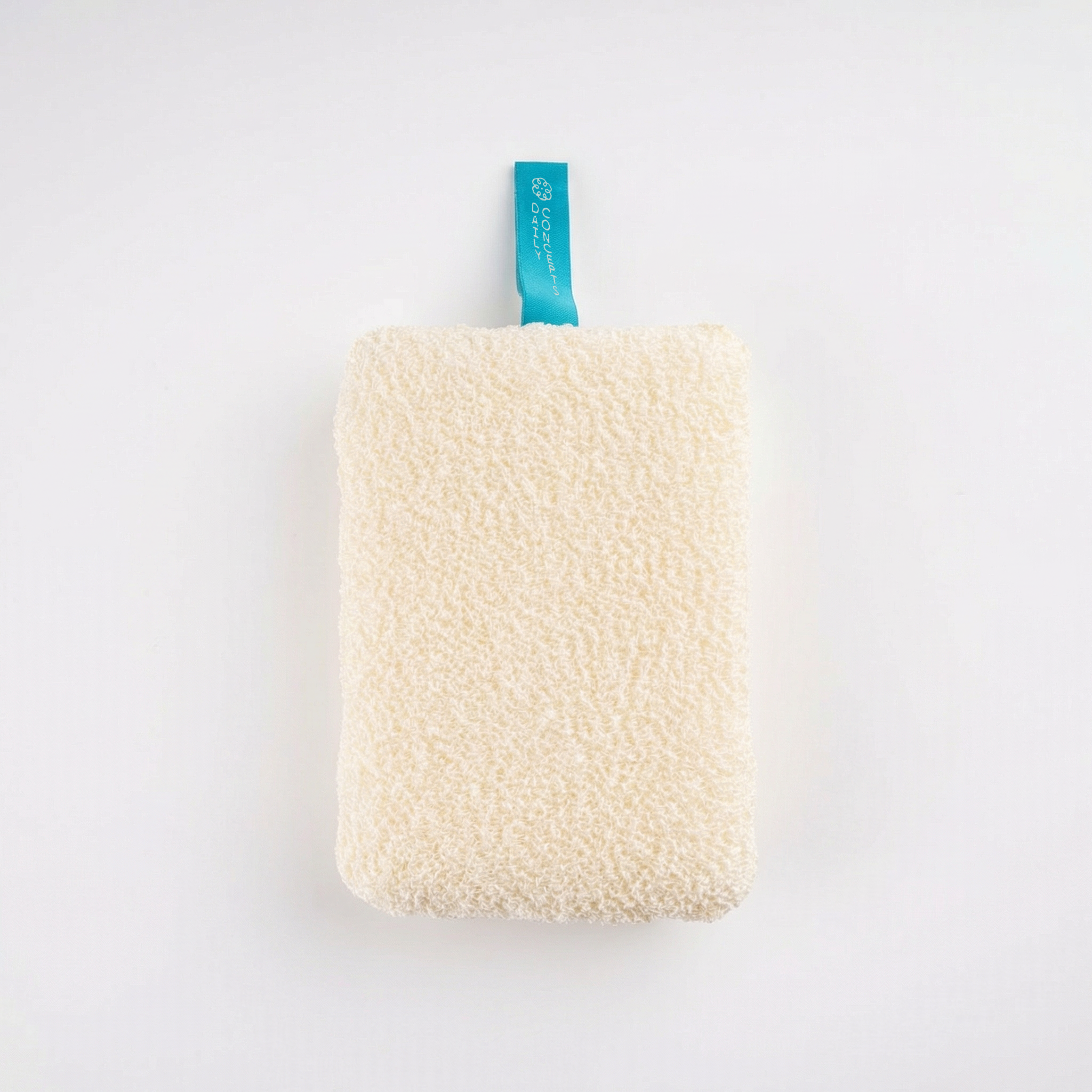 Square textured cleaning pad with a blue tag on a white background