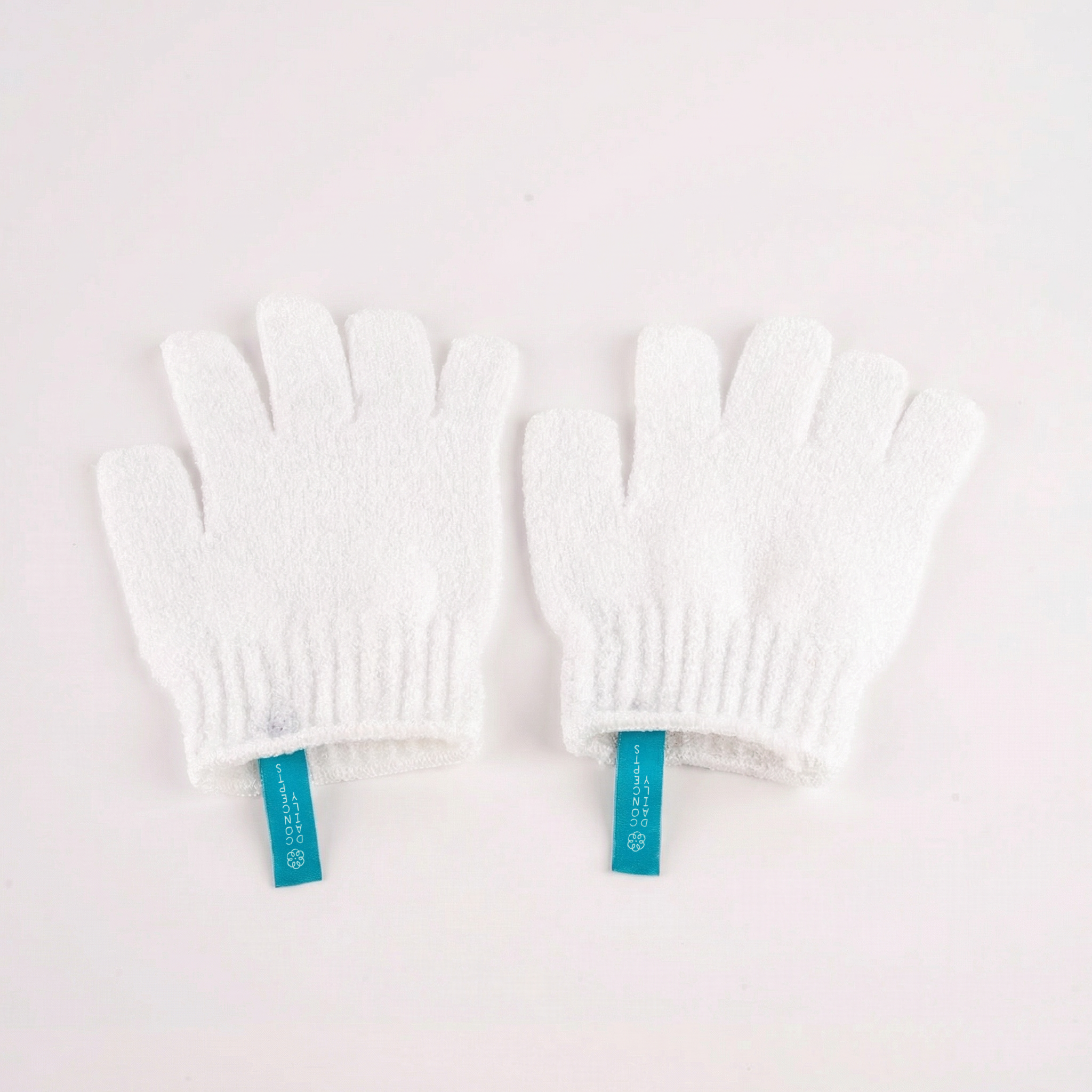 White gloves with blue labels on a white background