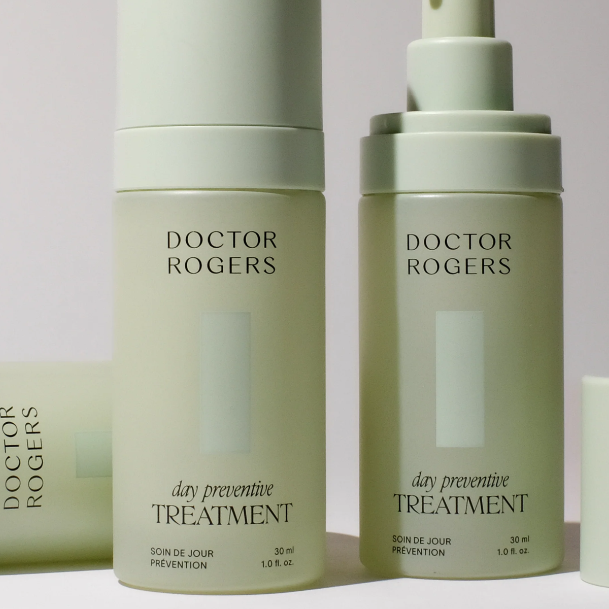 Two green skincare bottles labeled 'Doctor Rogers' on a light gray background