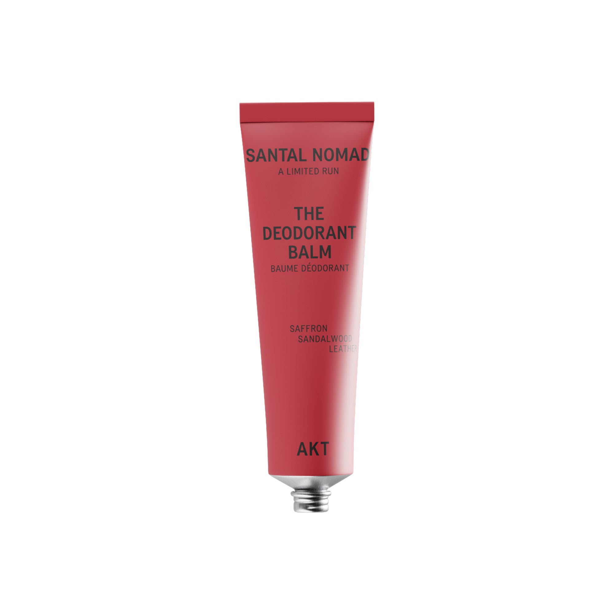 A red squeeze tube of Santal Nomad The Deodorant Balm on a plain white background.