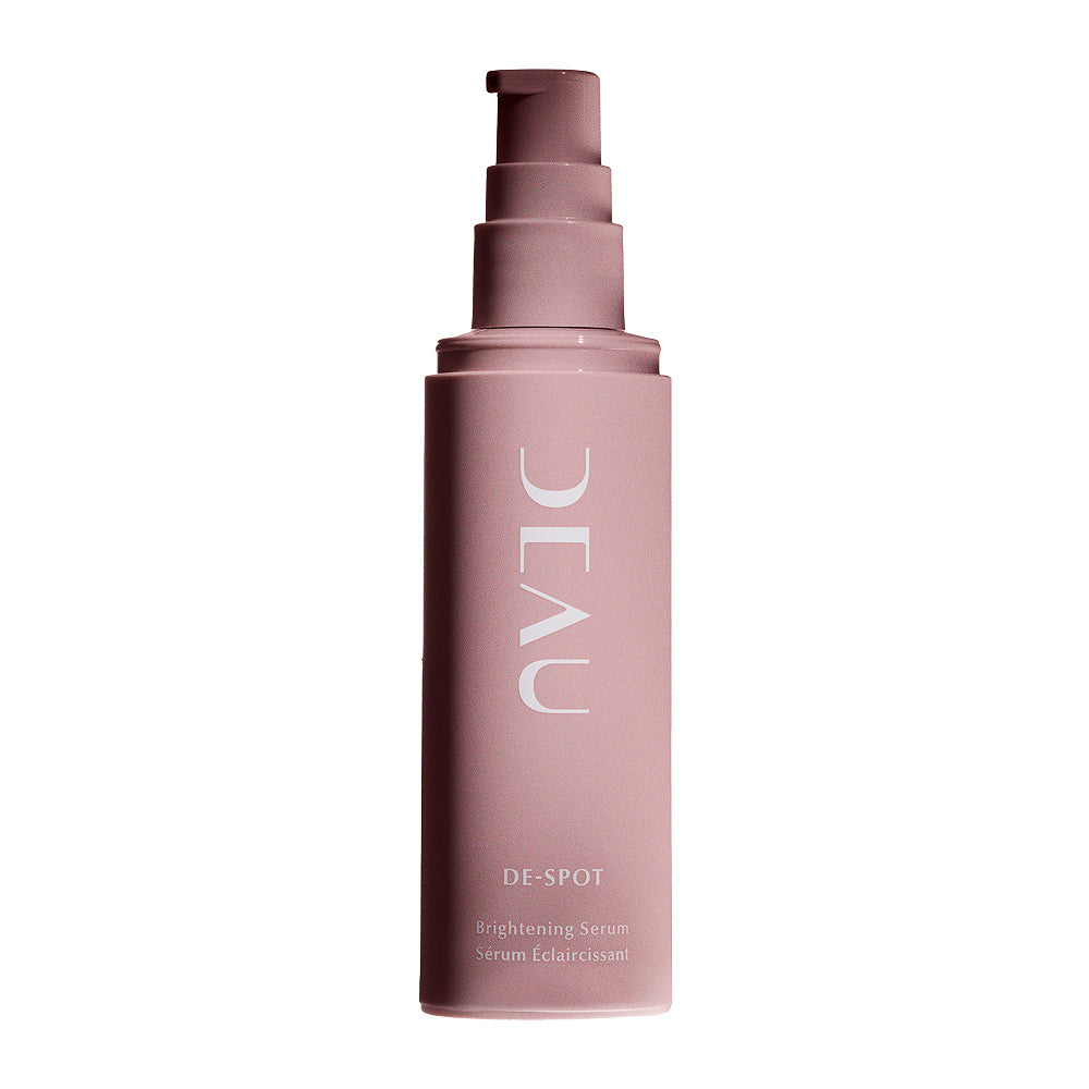 Pink skincare serum bottle with 'DEAU' branding on a white background