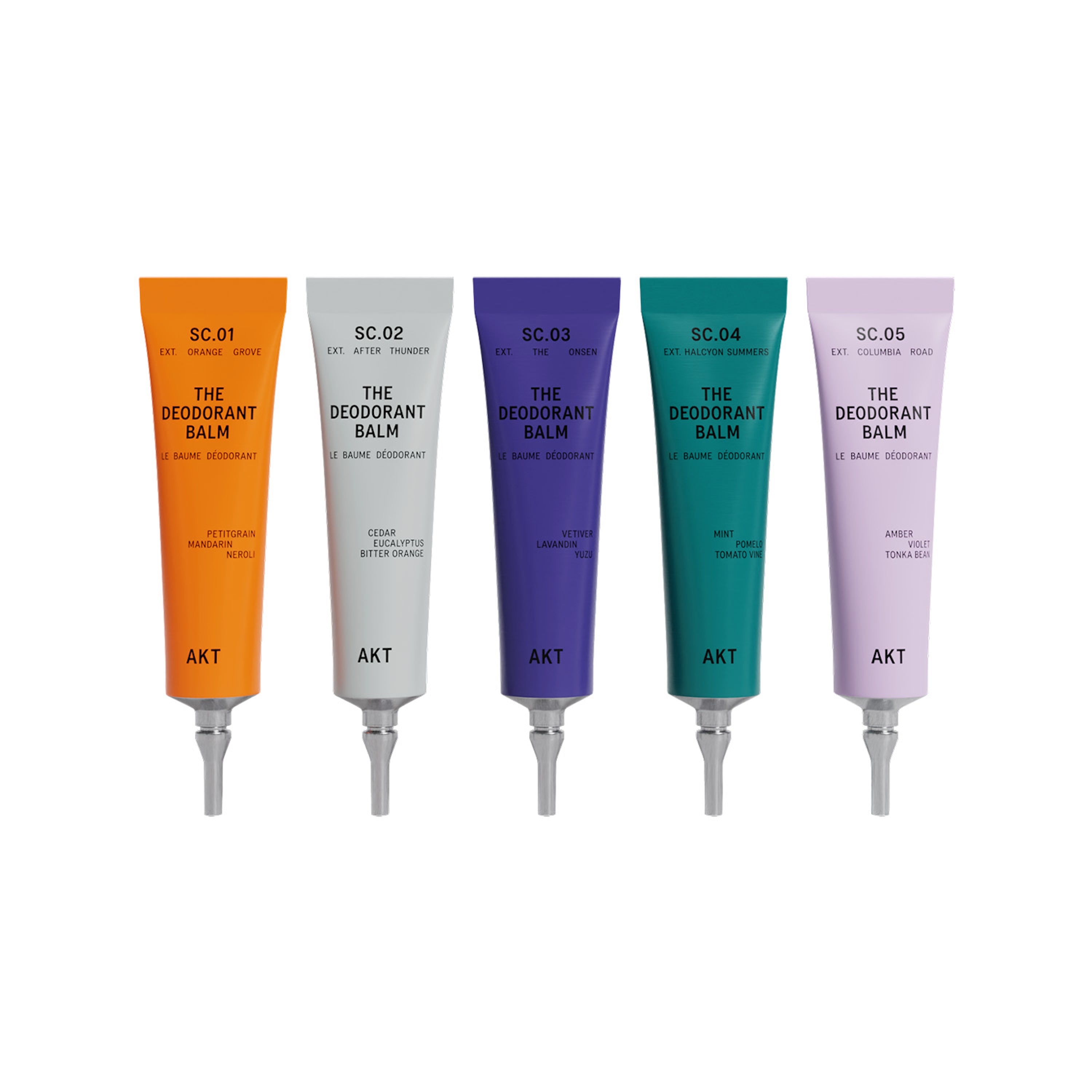 Five tubes of AKT 'The Deodorant Balm' in different colors on a white background.