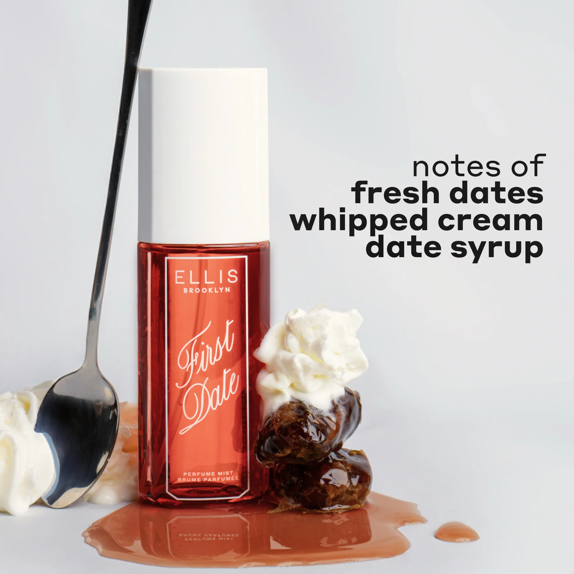 Perfume bottle labeled 'First Date' by Ellis Brooklyn with whipped cream and dates on a light background.