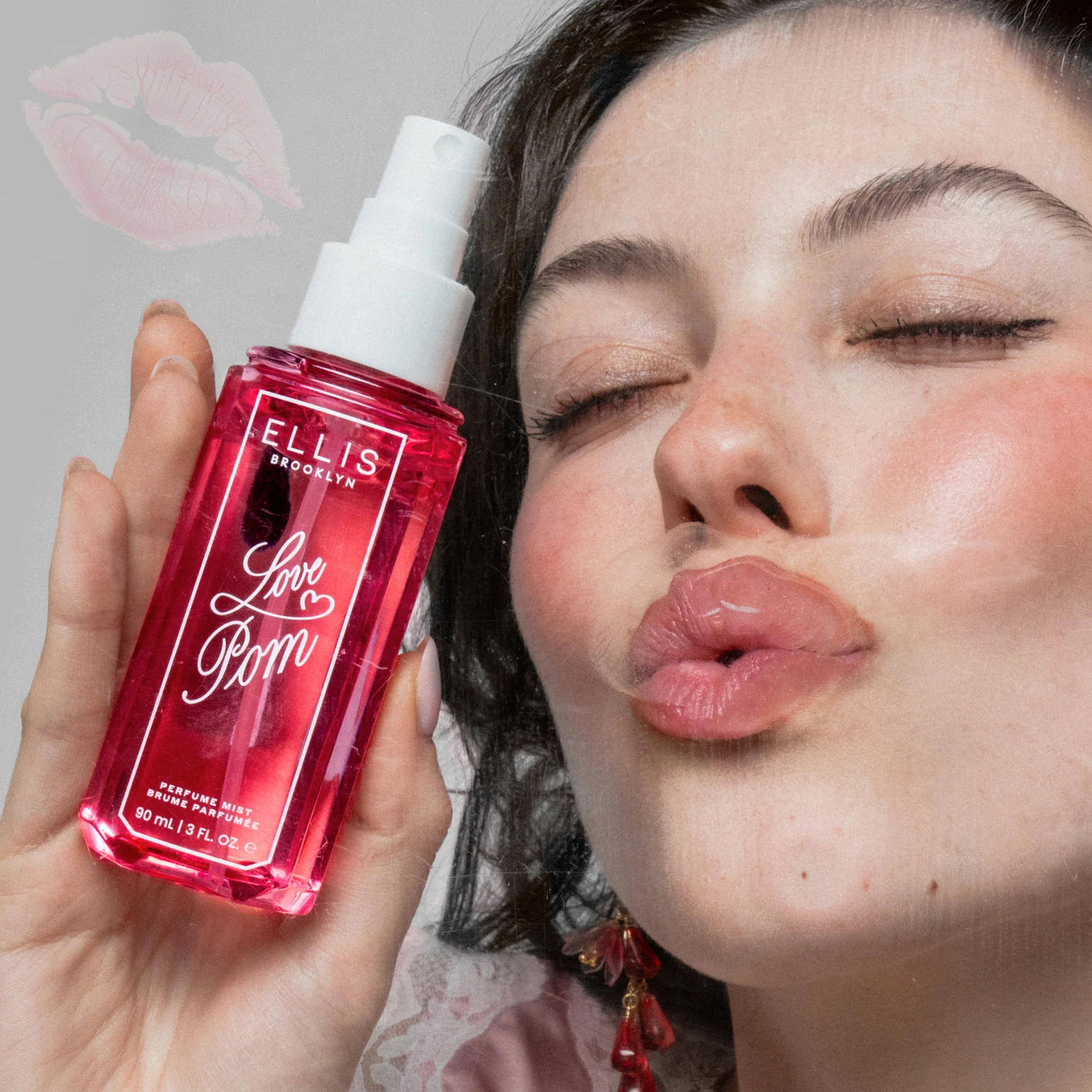 Person holding a red Ellis Brooklyn product with a neutral background