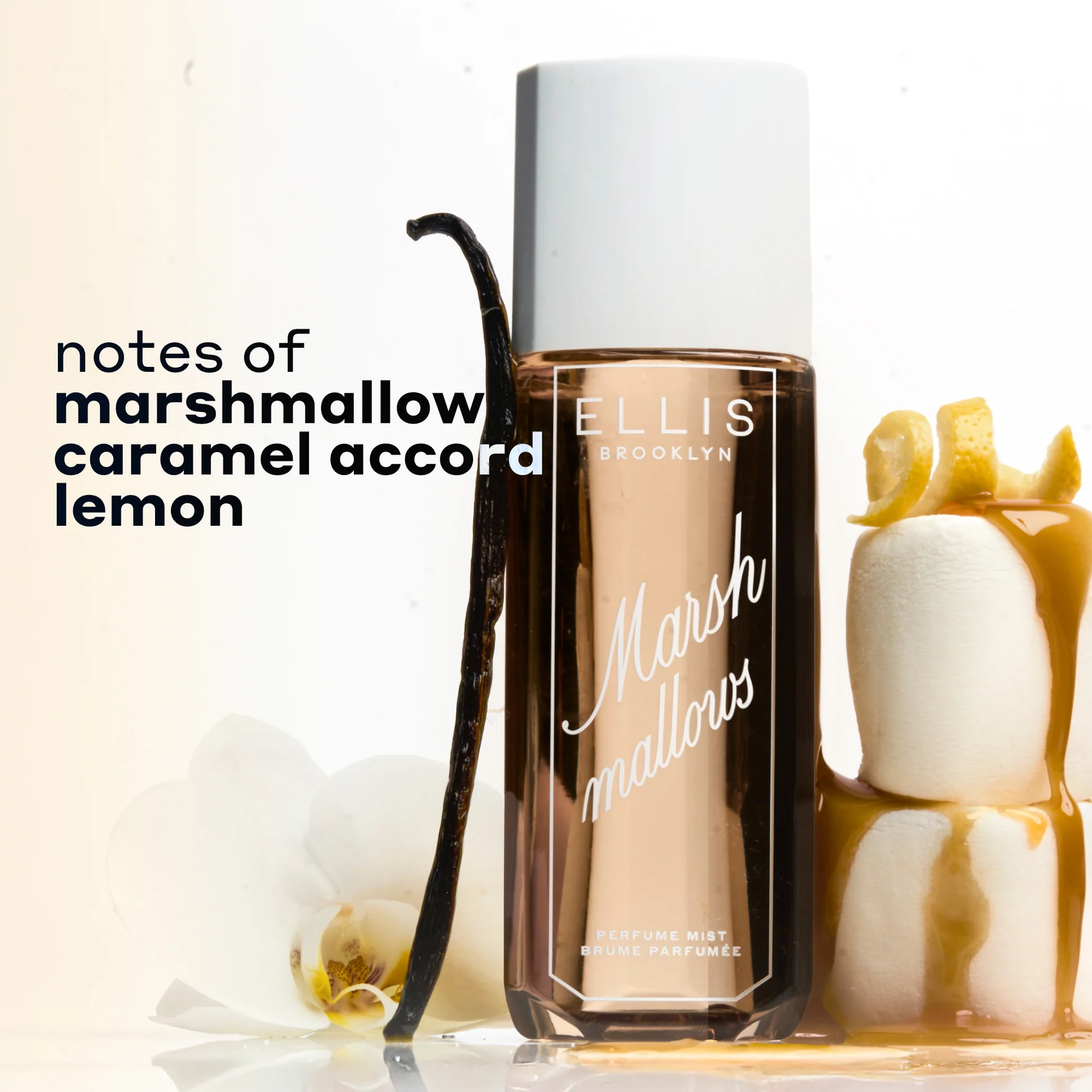 Ellis Brooklyn Marshmallows perfume bottle with vanilla bean, marshmallows, and lemon on a light background