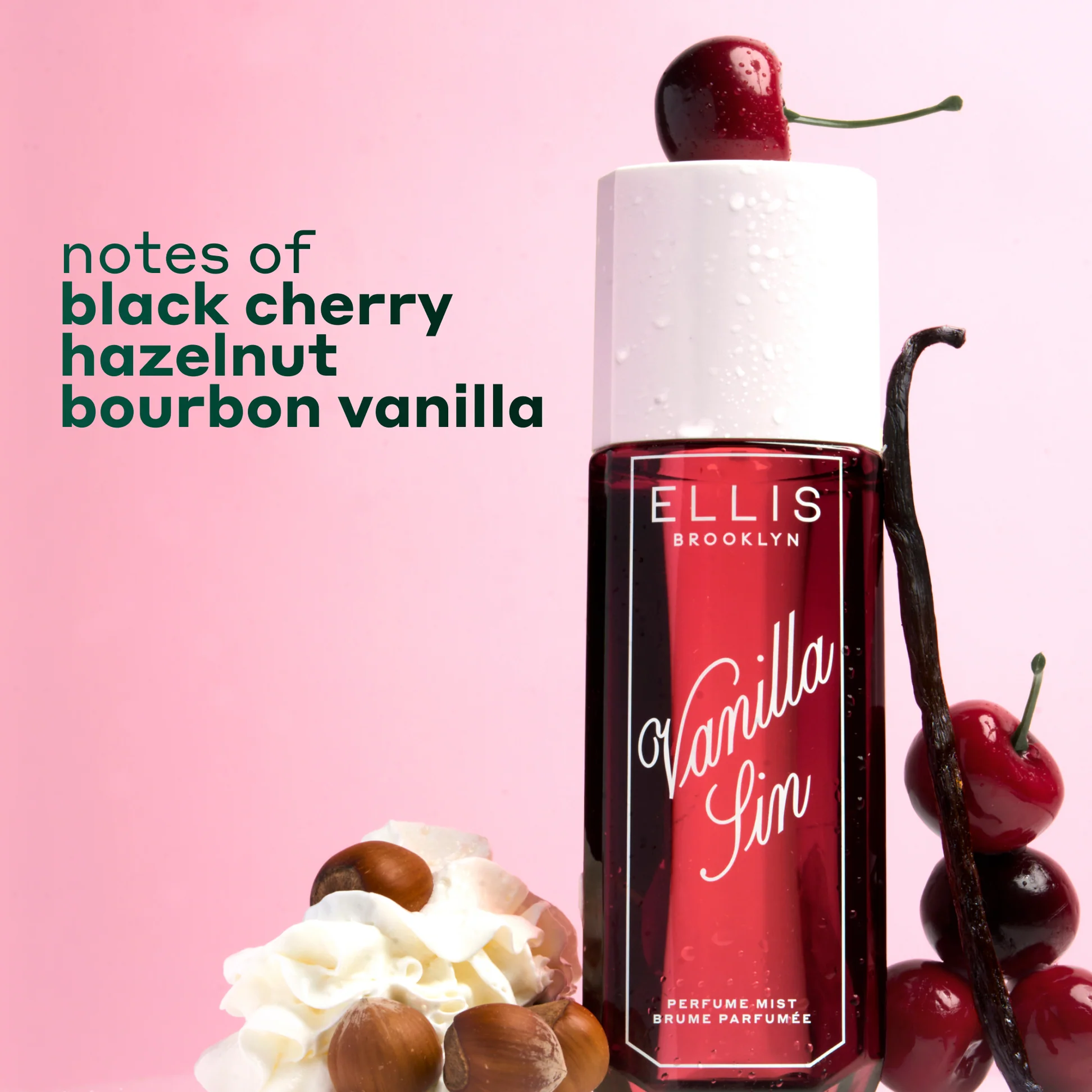 Perfume bottle with vanilla, black cherry, hazelnut, and bourbon notes on a pink background
