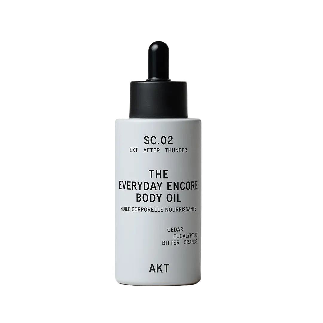 Bottle of 'The Everyday Encore Body Oil' by AKT on a white background