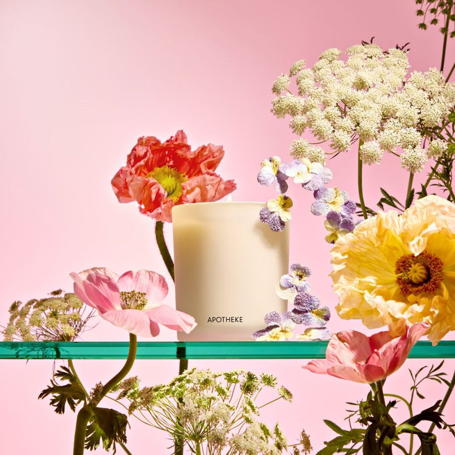 Apothekes Elderflower Sugar Candle with flowers on a pink background