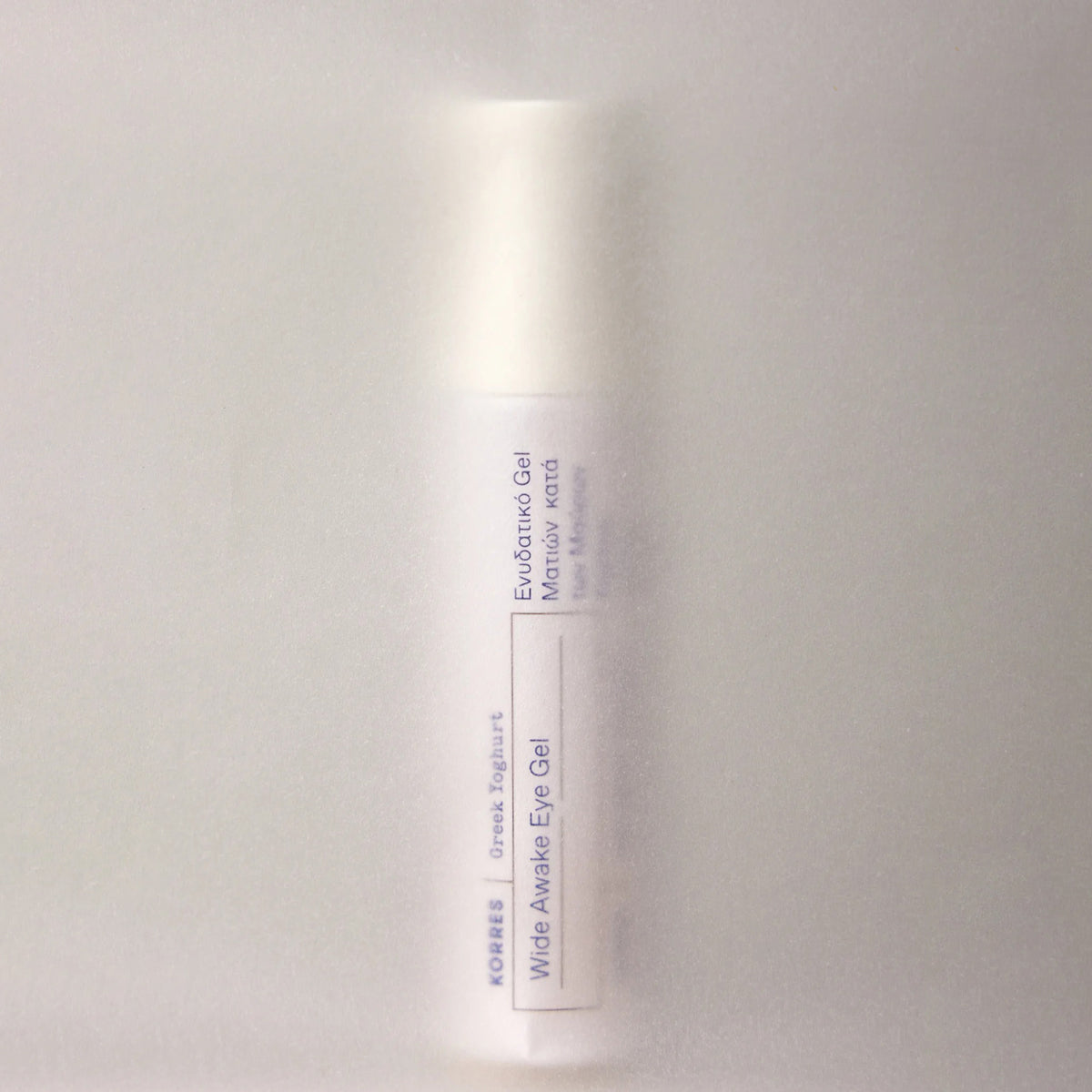 Skincare bottle with label on a light gray background
