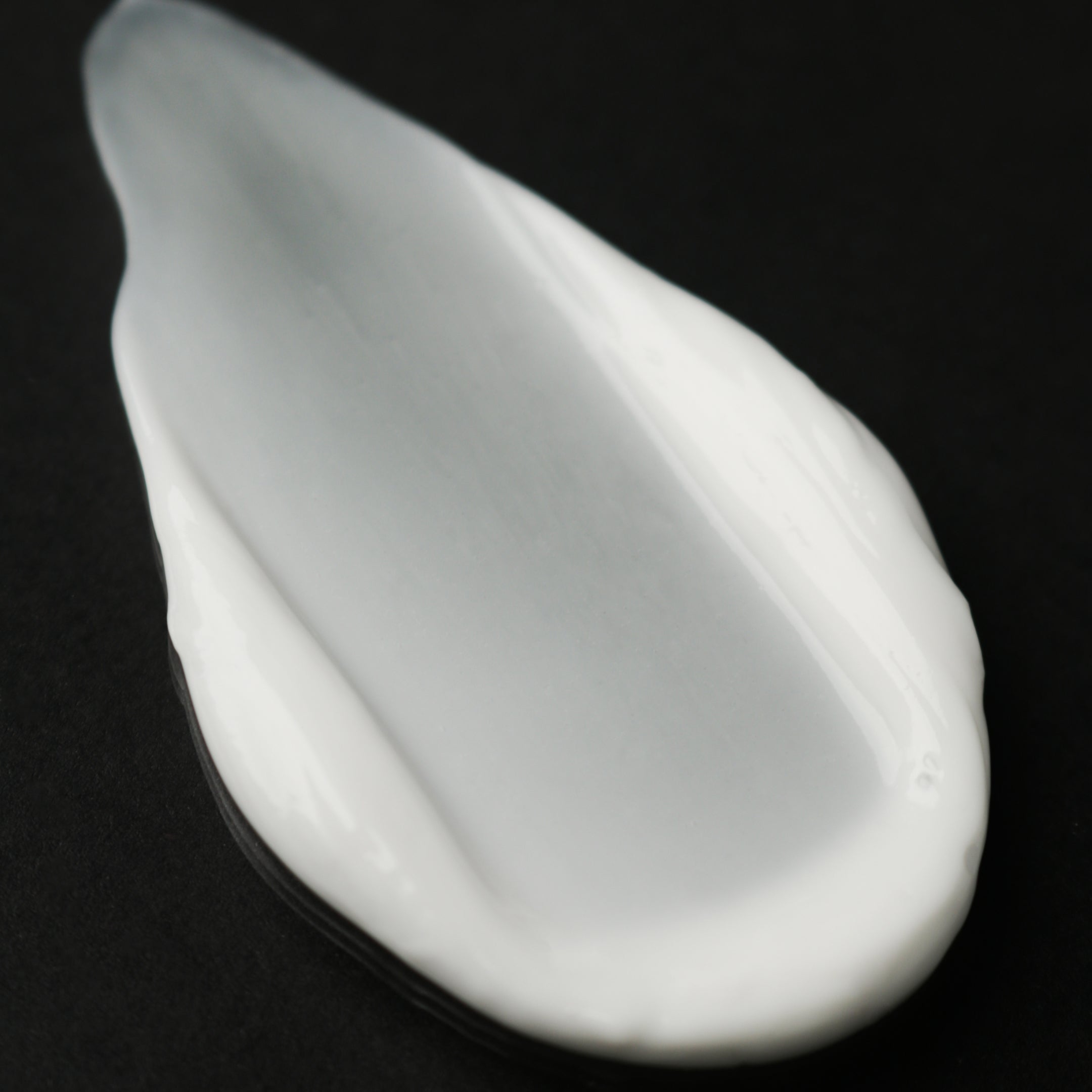 White product swatch on a black background