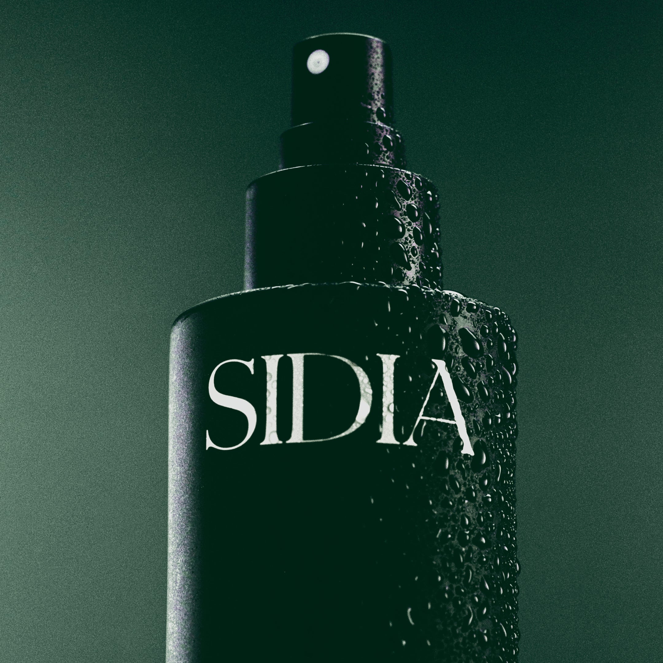Black spray bottle with 'SIDIA' branding on a dark green background