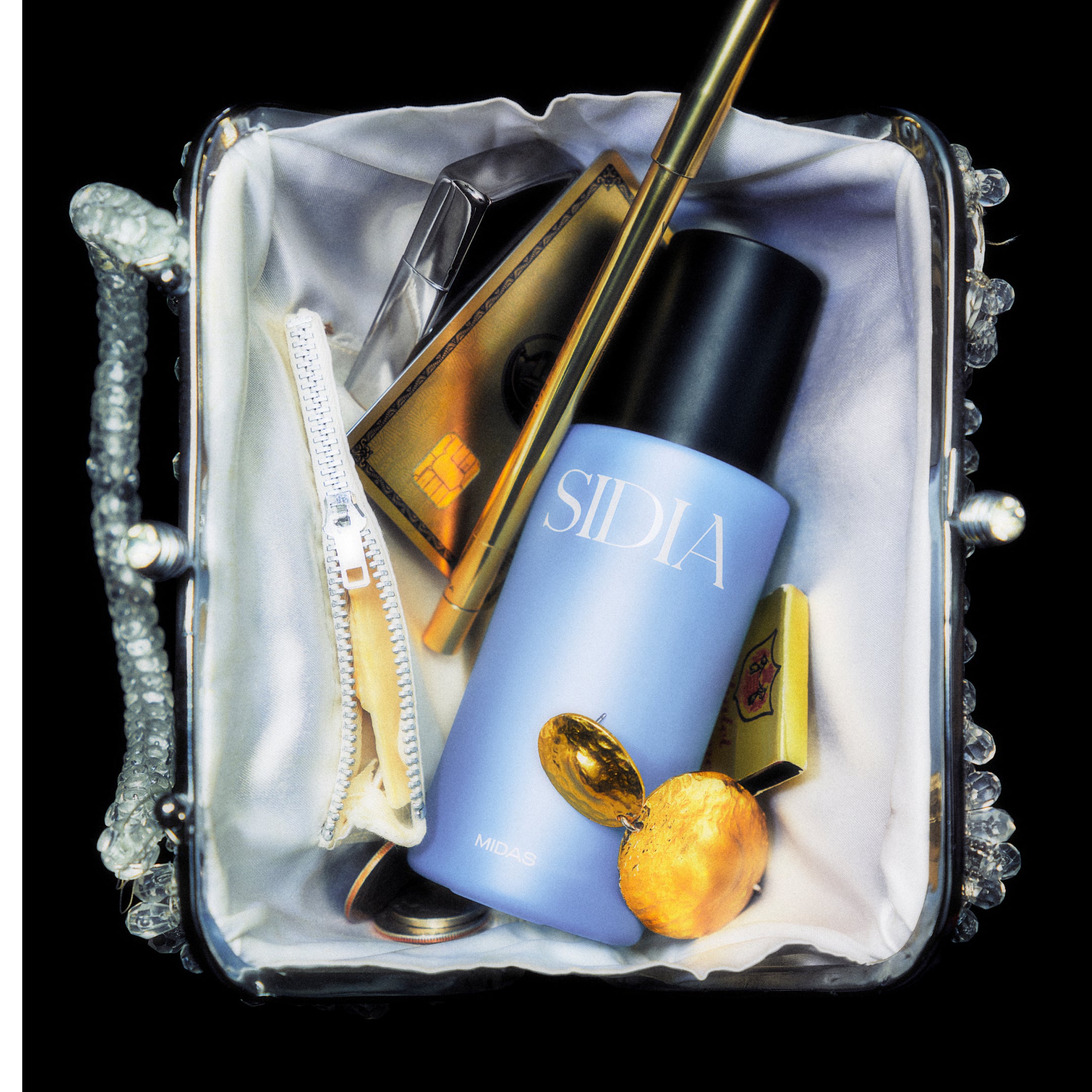 SIDIA branded body its in a purse amongst various items