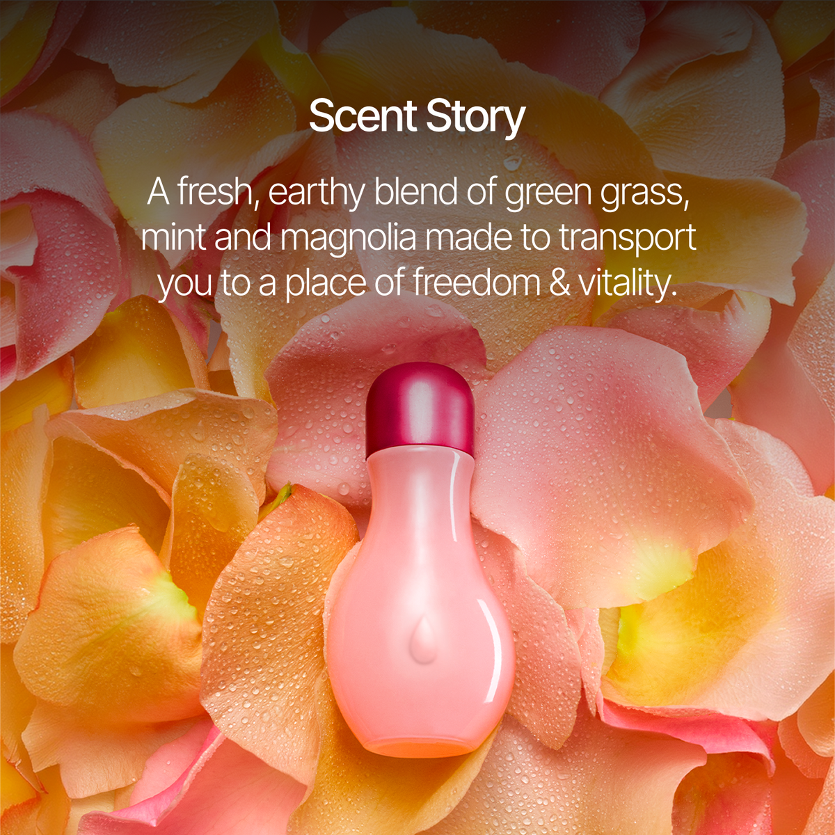 A small pink perfume bottle with a dark pink cap sits on a bed of peach and pink flower petals with white text above reading 'Scent Story' and a scent description about green grass, mint, and magnolia.