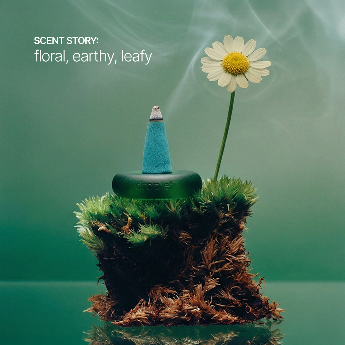 A green incense burner sits on mossy terrain with a white daisy flower and smoke in the background. Text in the upper left reads 'SCENT STORY: floral, earthy, leafy'.