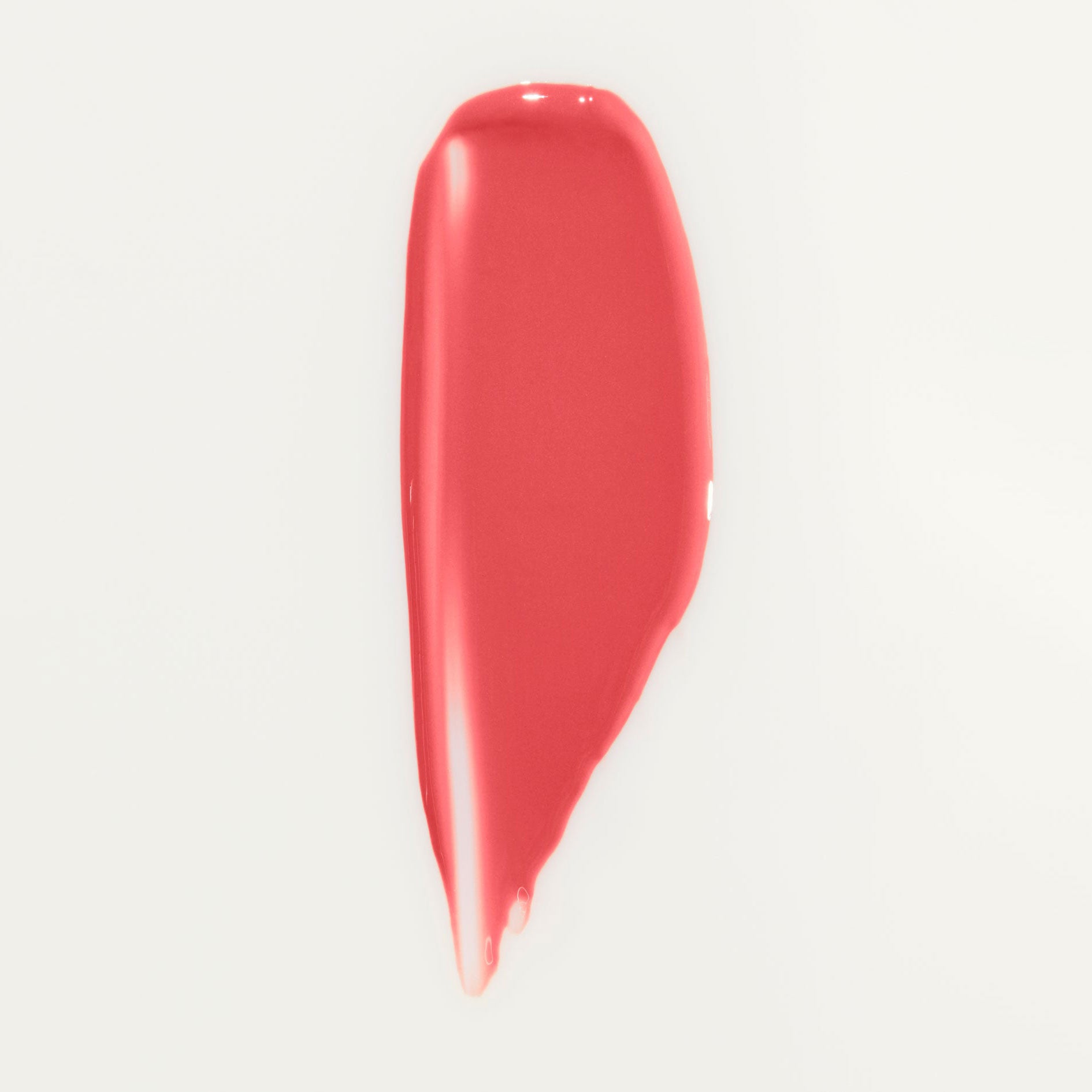 Swatch of Wonderblush Lip Oil in shade Geranium.