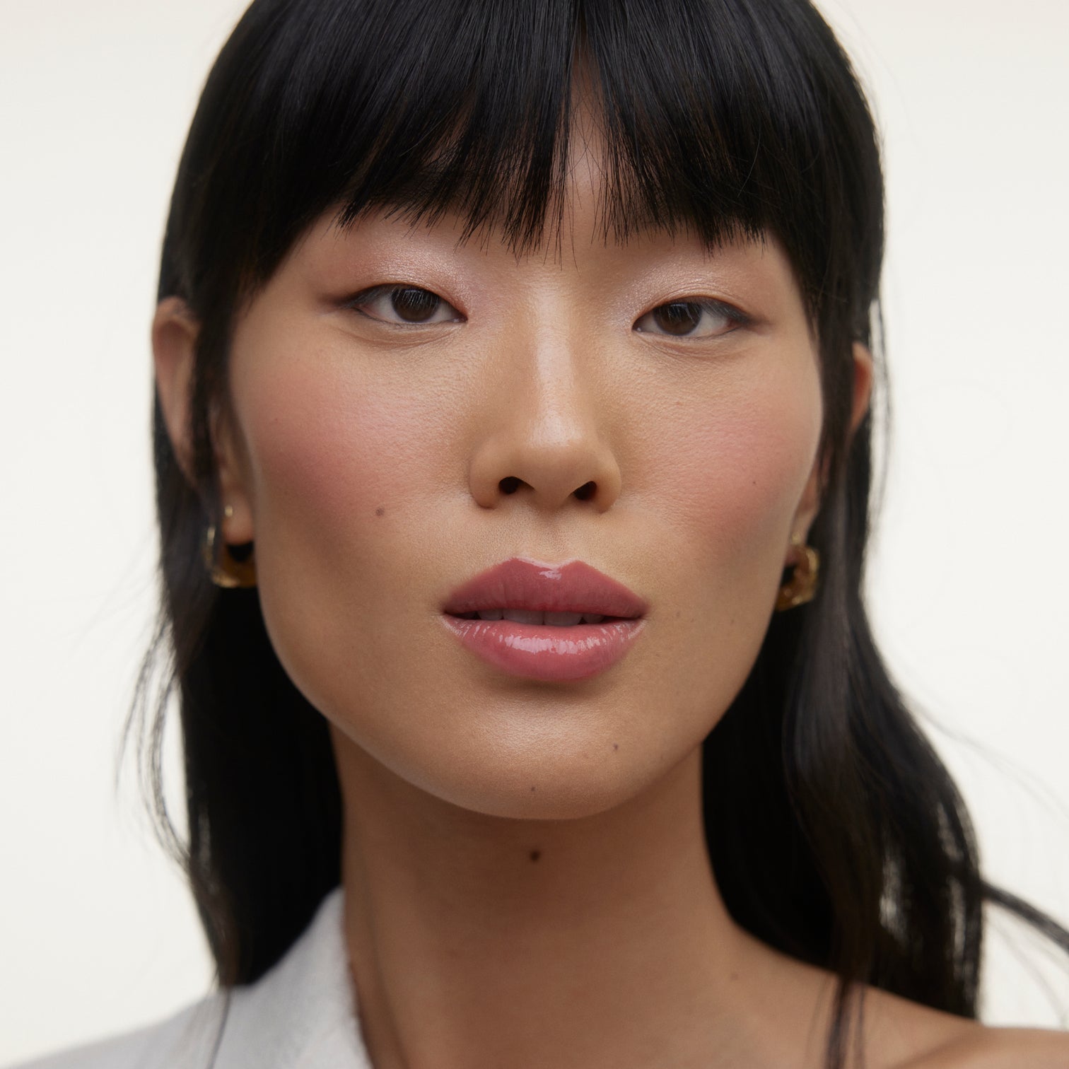 Closeup of woman's face wearing Wonderblush makeup.