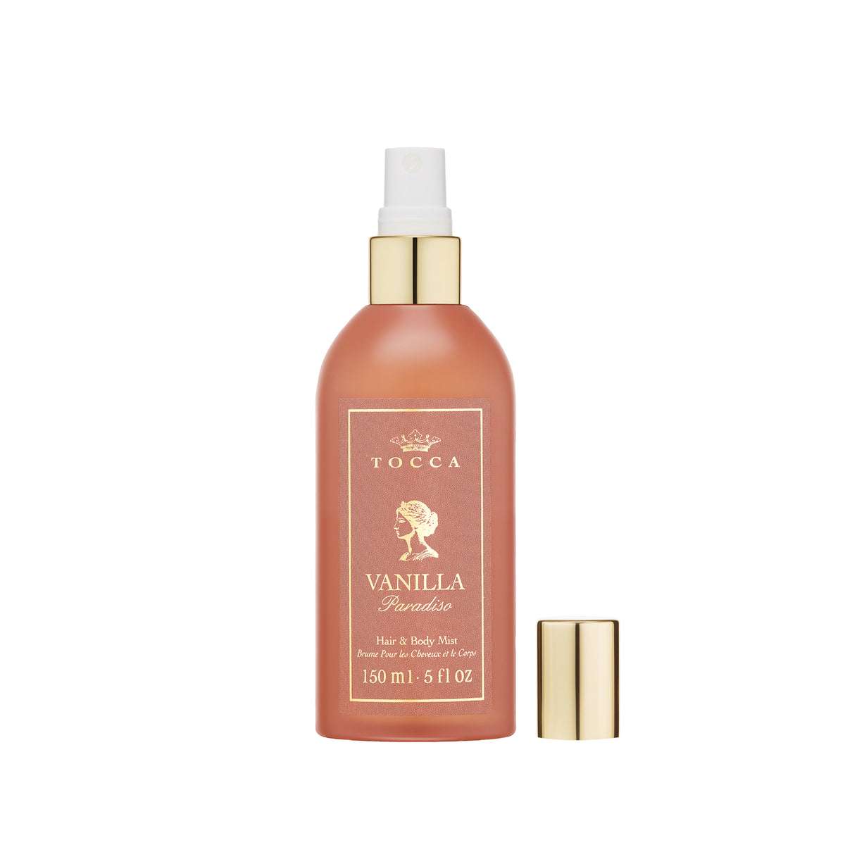 TOCCA Vanilla Paradiso - Hair and Body Mist in a frosted peach bottle with gold accents, shown with its cap off next to the bottle on a white background.