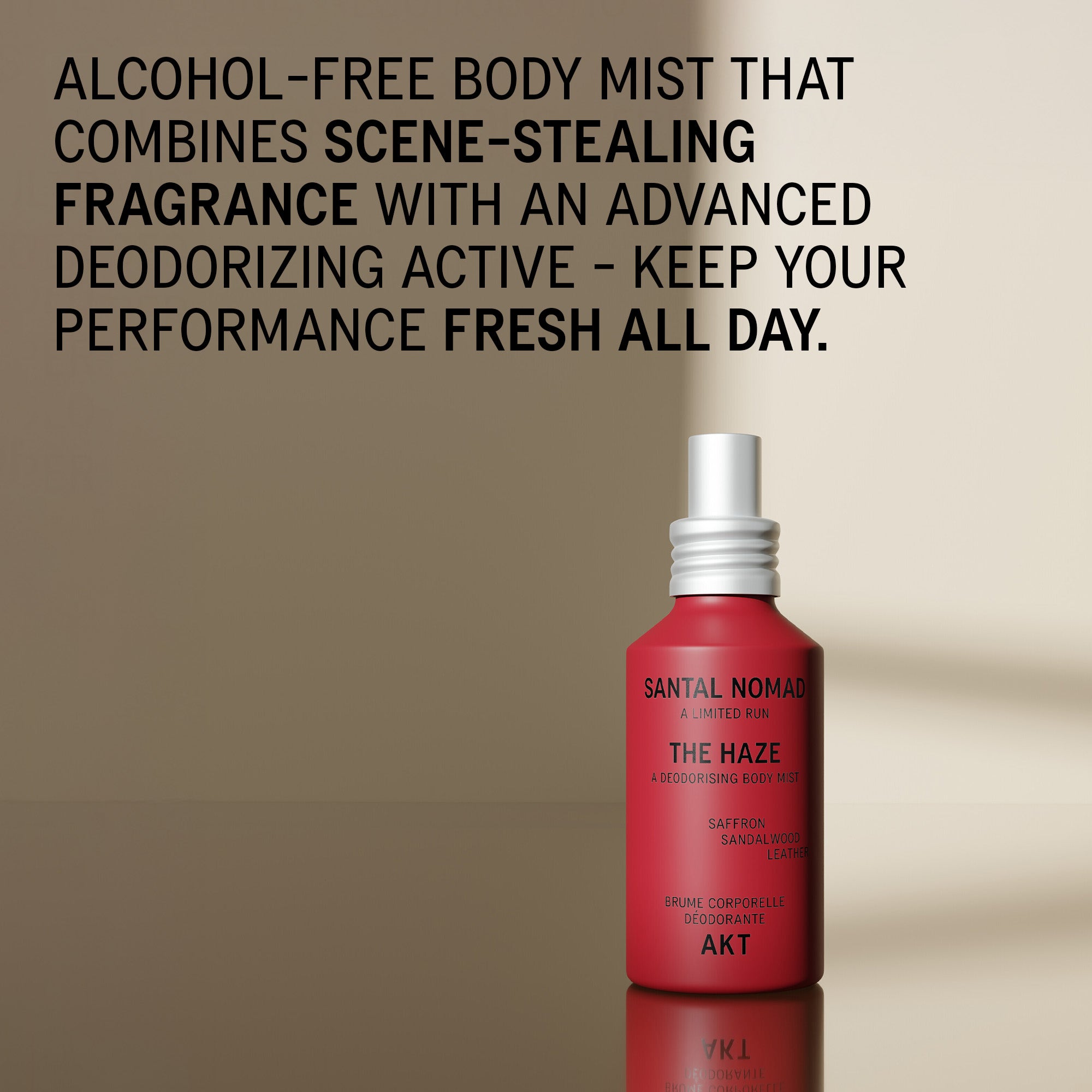 A red bottle of The Haze - Santal Nomad - Limited Edition alcohol-free body mist with a white spray nozzle, set against a warm beige gradient background with black promotional text.
