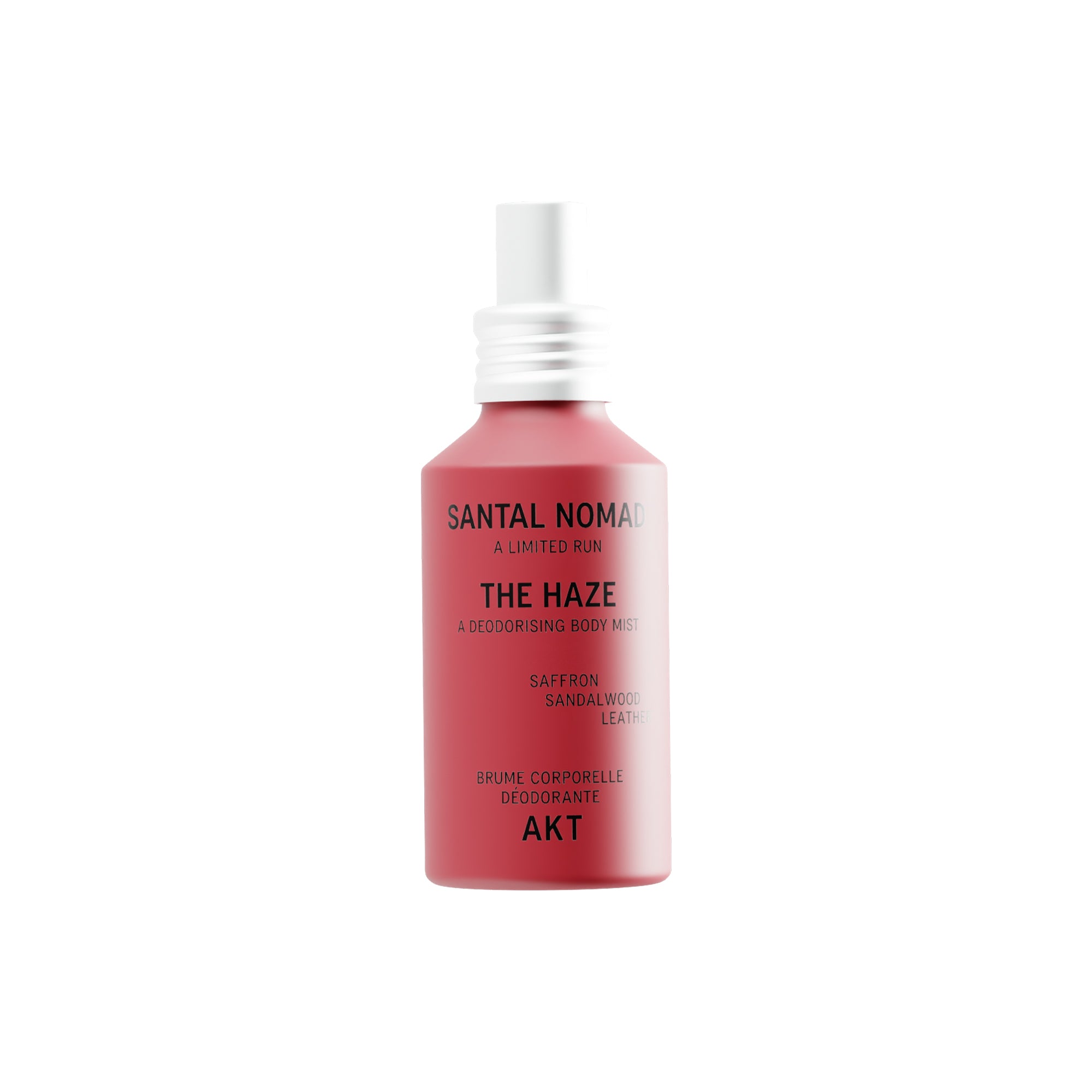 A red spray bottle of The Haze - Santal Nomad - Limited Edition deodorizing body spray, featuring a white spray nozzle and silver collar, on a solid white background.