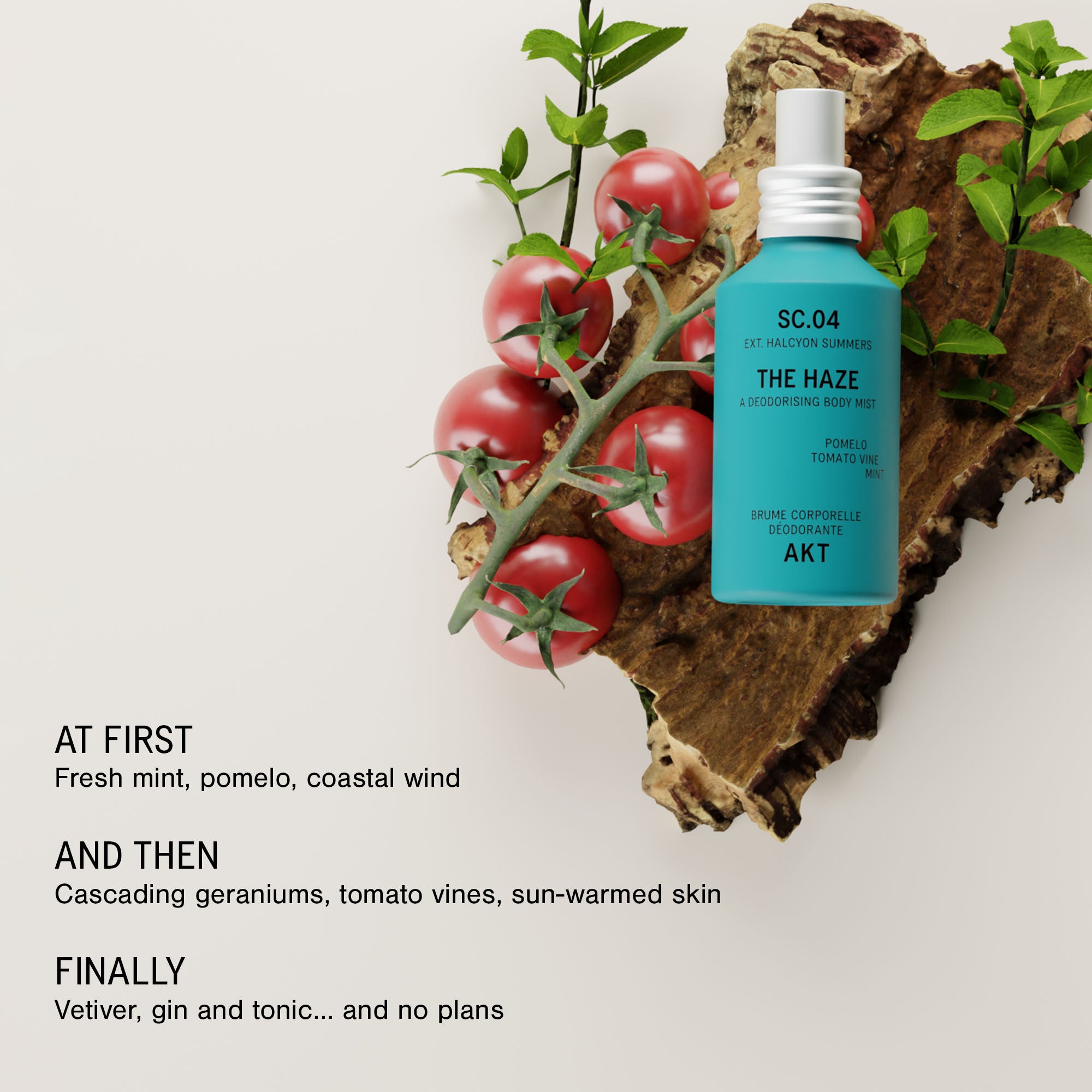Bottle of AKT The Haze SC. 04 Halcyon Summers styled on a piece of driftwood with red tomatoes and green leaves against a light background, with text describing the fragrance notes.
