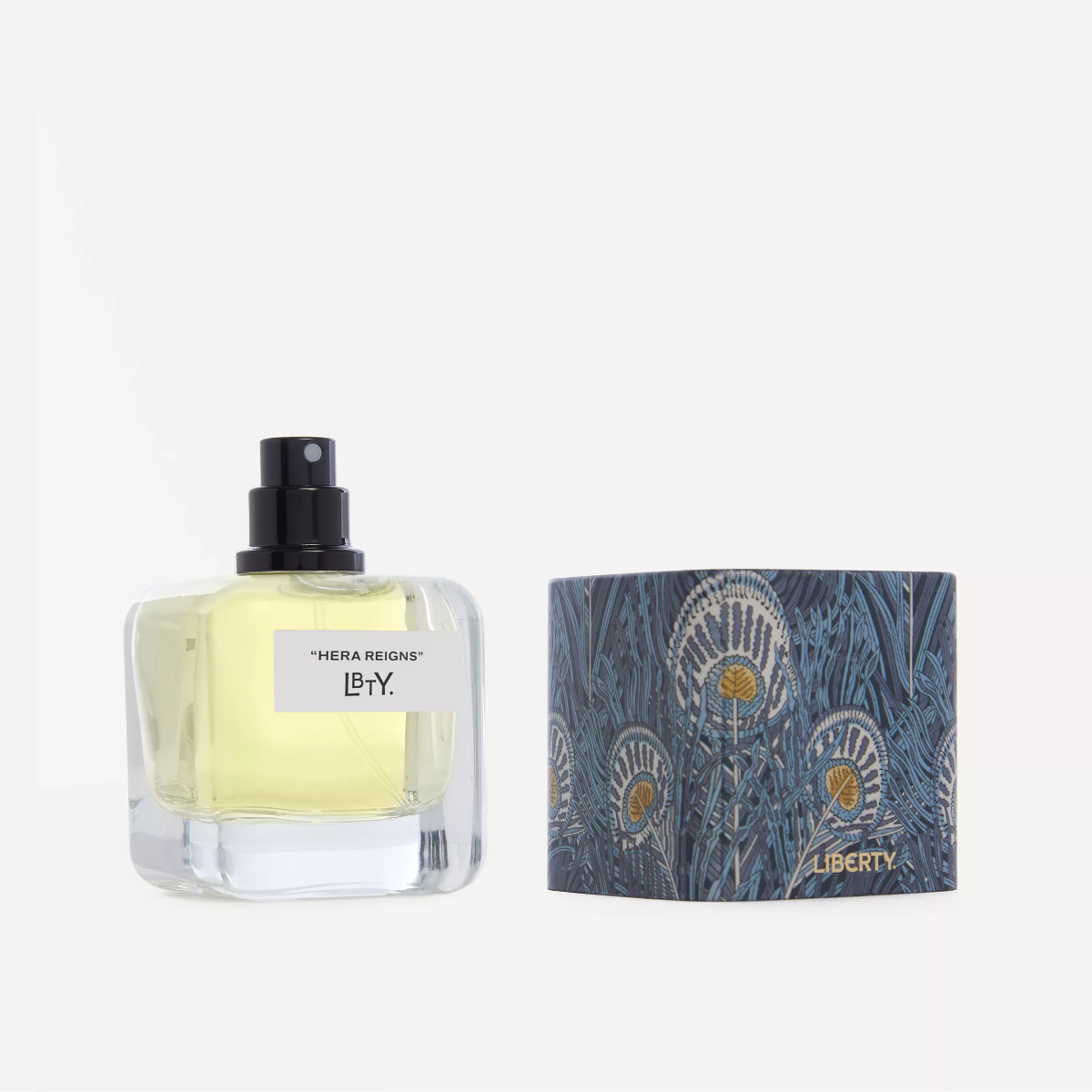 Perfume bottle with decorative packaging on a white background
