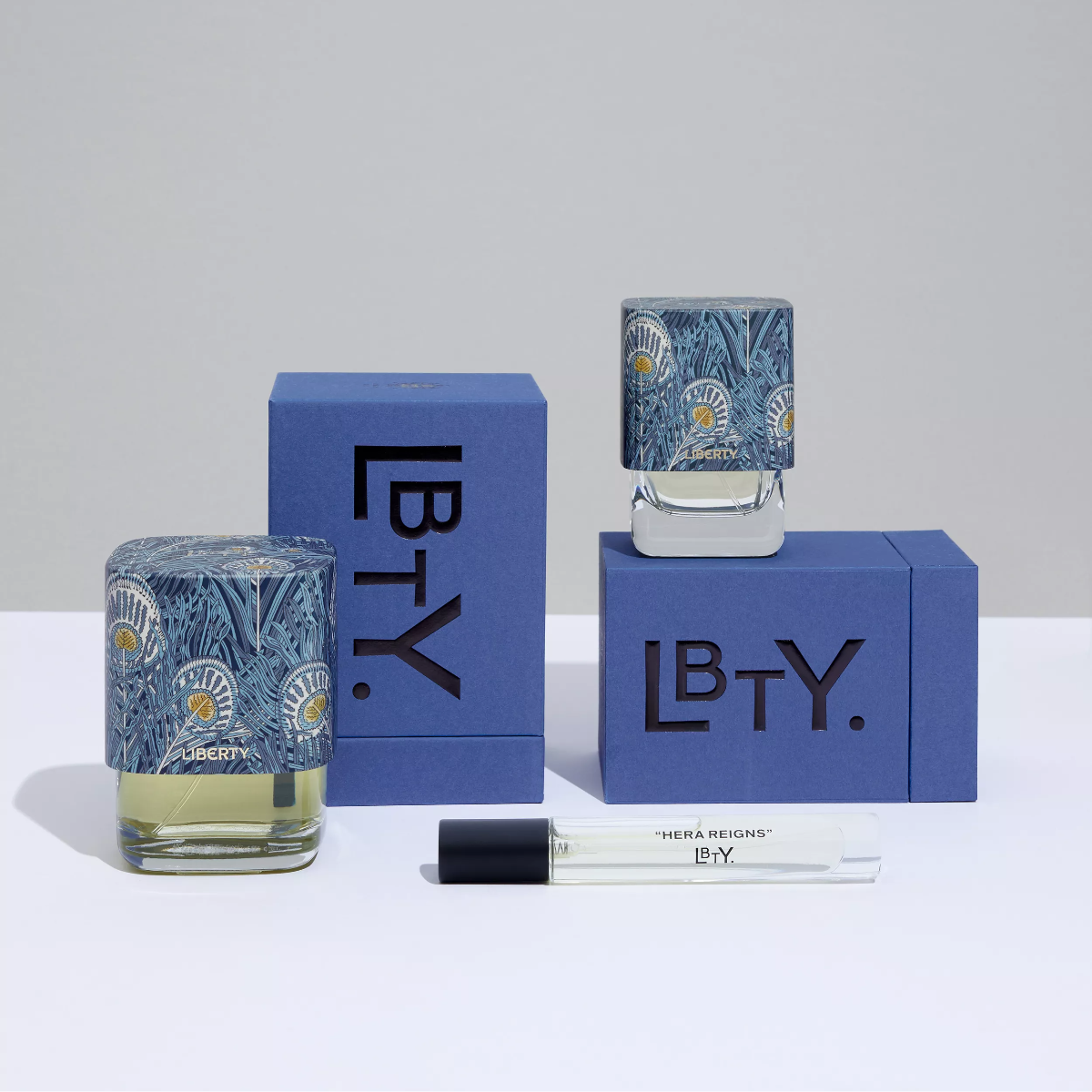 LB.TY perfume set with two bottles and a box on a light gray background