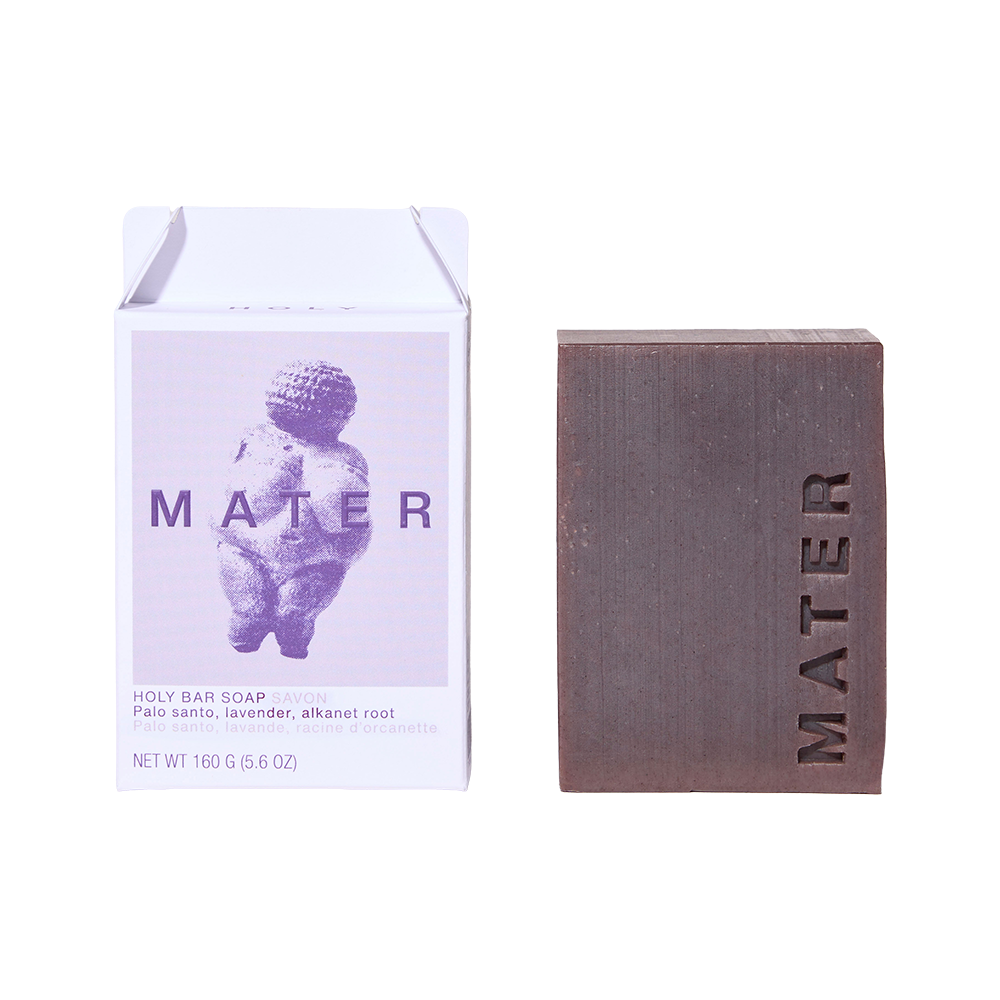 Holy Bar Soap by MATER shown next to its white and lavender packaging box on a plain white background.