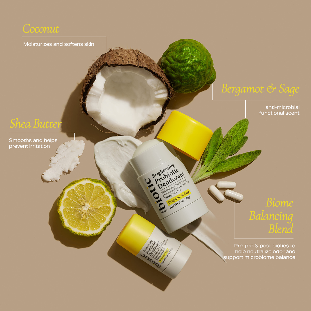 Biotic Beauty's Brightening Probiotic Deodorant surrounded by ingredients including coconut, shea butter, bergamot, sage, and a biome balancing blend of pre, pro, and post biotics.