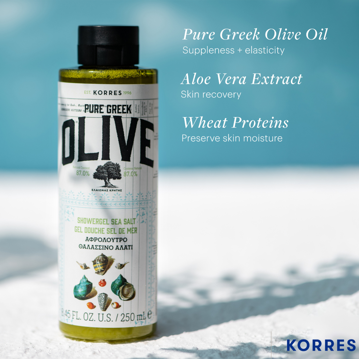 Korres Pure Greek Olive oil bottle with product benefits on a snowy background