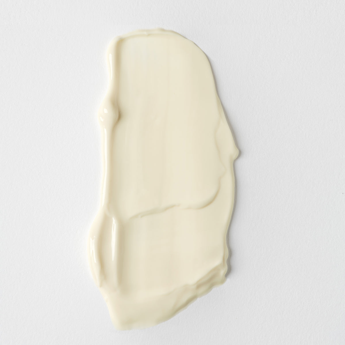 A swatch of Santorini Grape Poreless Skin Cream spread on a plain white background.