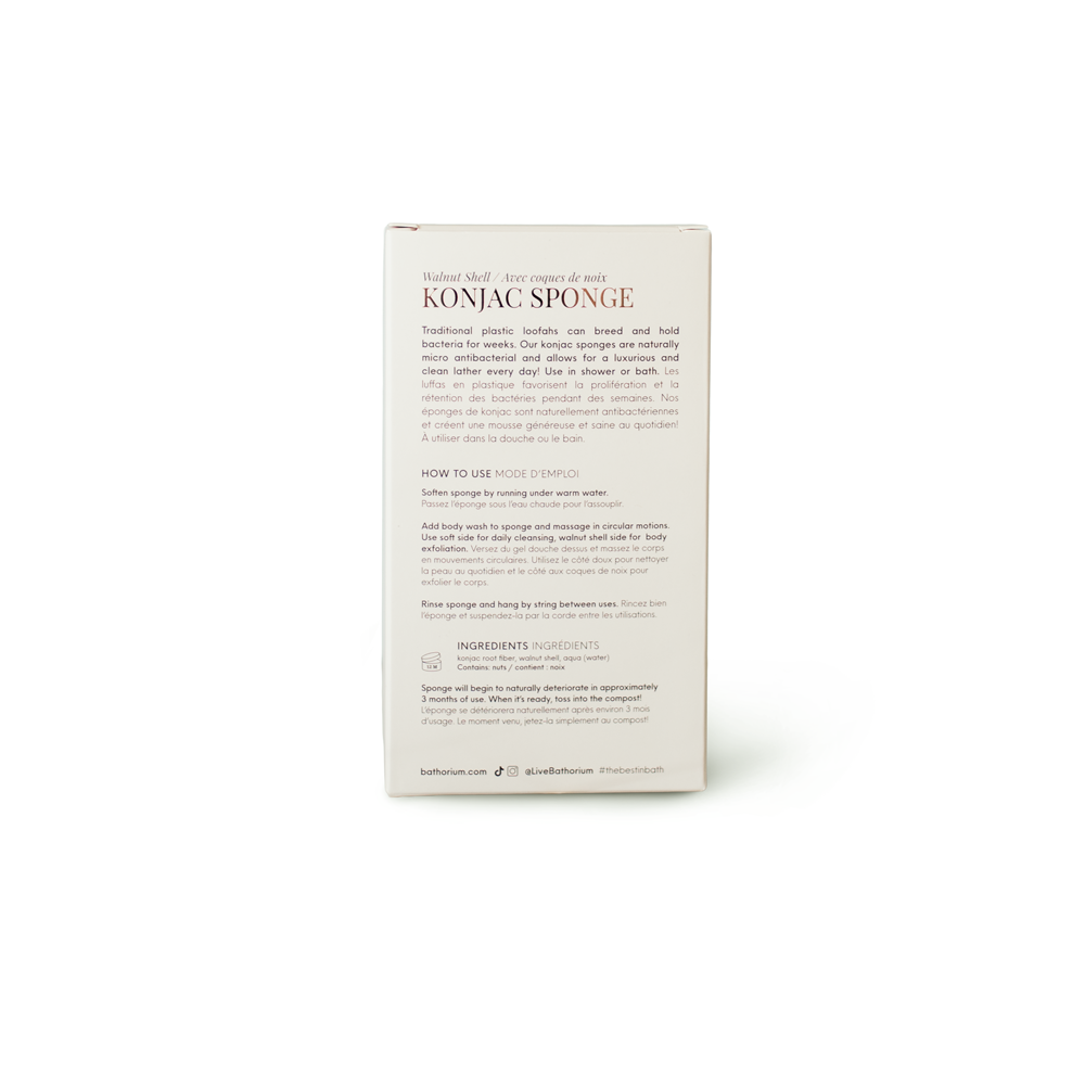 The back of a white rectangular product box for Konjac Sponges, featuring black and brown text, photographed on a clean white background with a soft shadow.