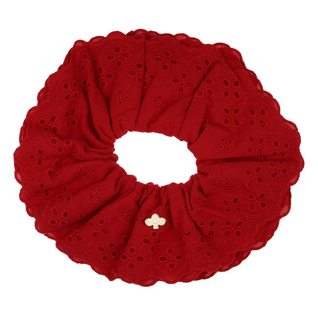 Red eyelet scrunchie on a white background