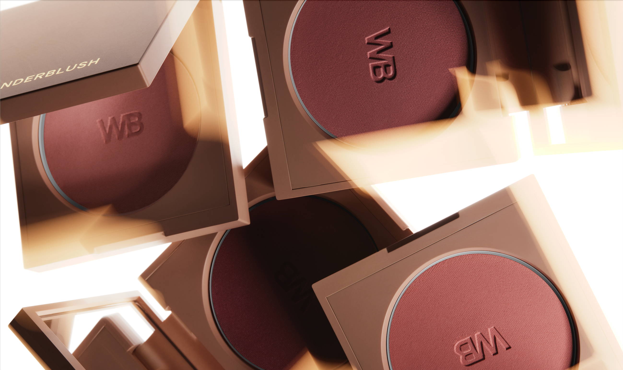 Lifestyle image of 4 Wonderblush Blush palettes floating or falling and illumitated by a warm light.