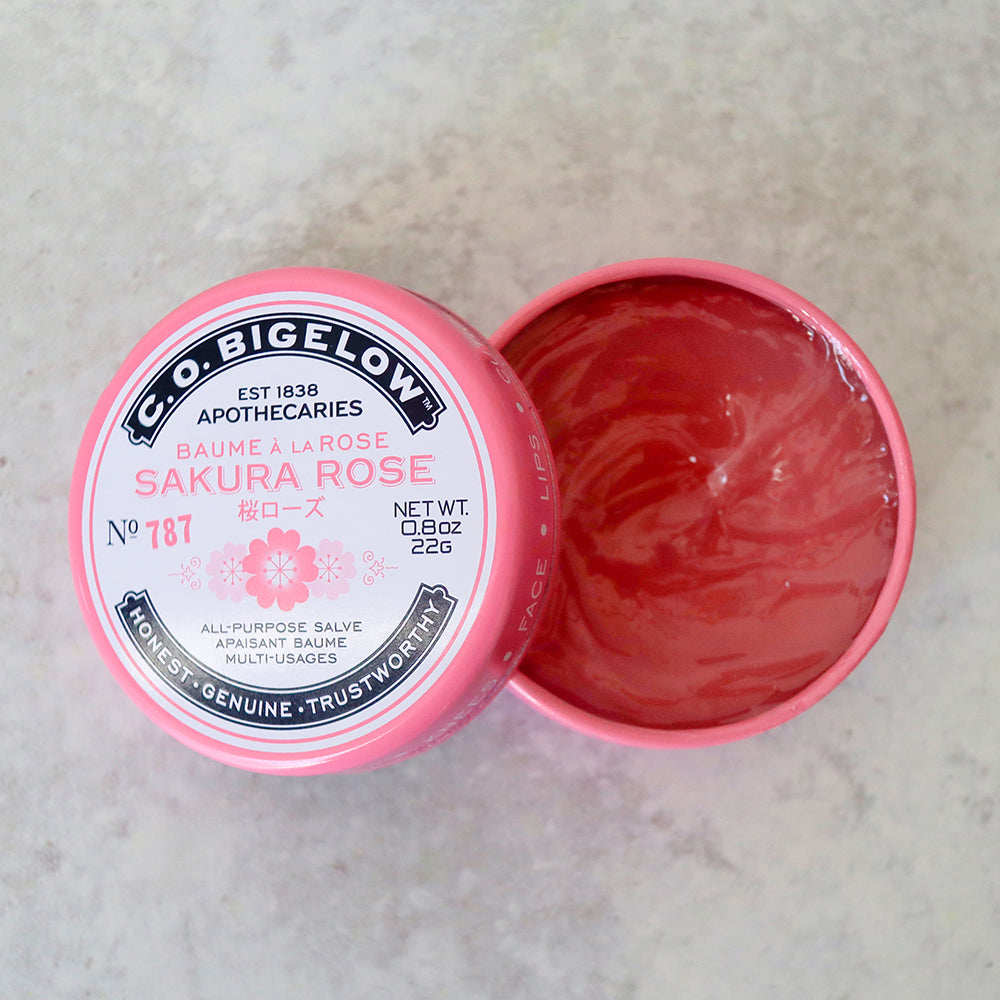 Pink jar of C.O. Bigelow Sakura Rose salve on a light gray background