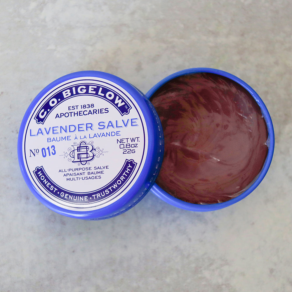 C.O. Bigelow Lavender Salve in an open blue container on a light gray background